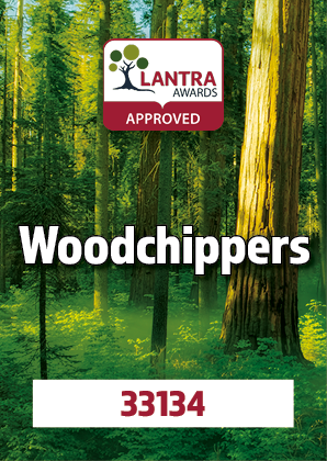 A forest with tall trees and sunlight coming through the leaves, displaying a certification badge for the LANTRA Awards approved Woodchippers.