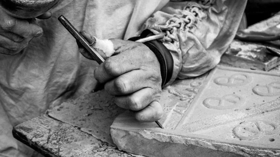 Man Carving Stone.jpg