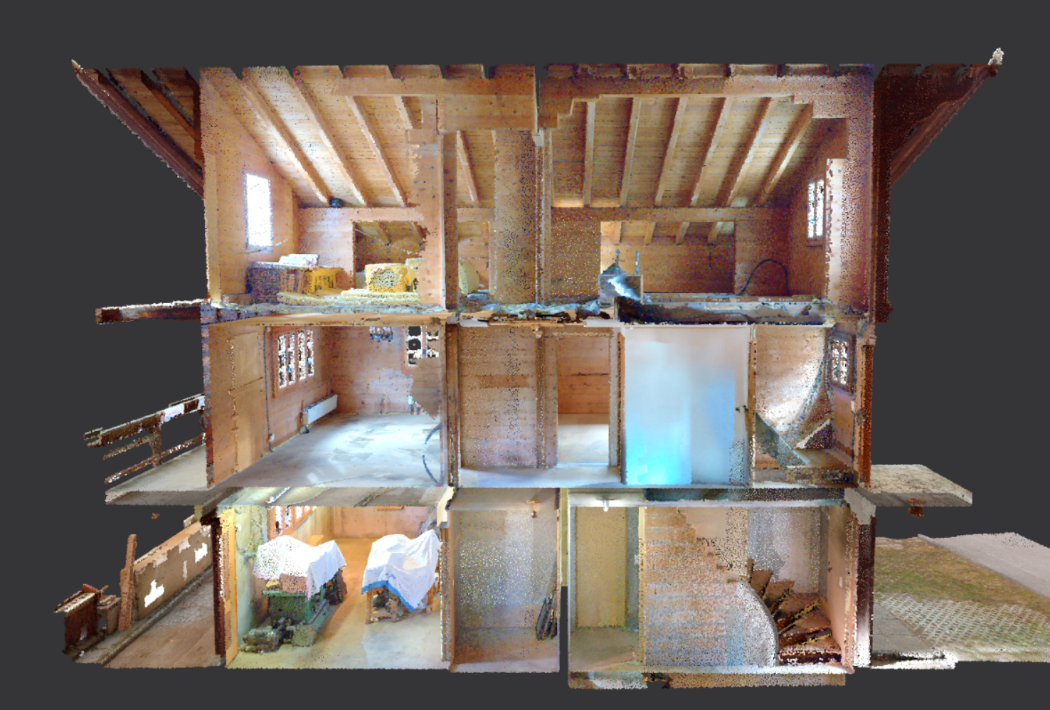 Innenansicht eines mehrstöckigen Holzhauses mit mehreren kleinen Zimmern, Stufen und Möbeln.