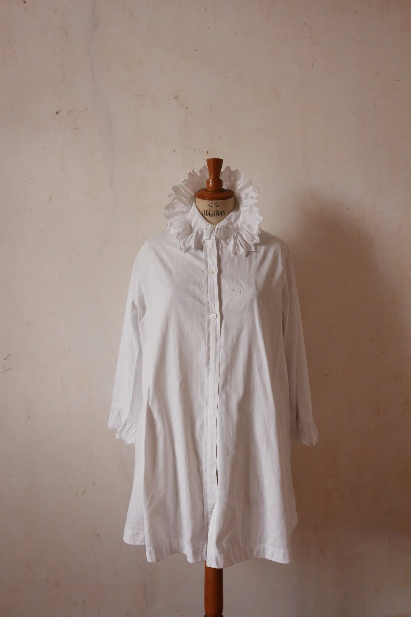 An exquisite late 19th or early 20th century cotton bedjacket initials MB