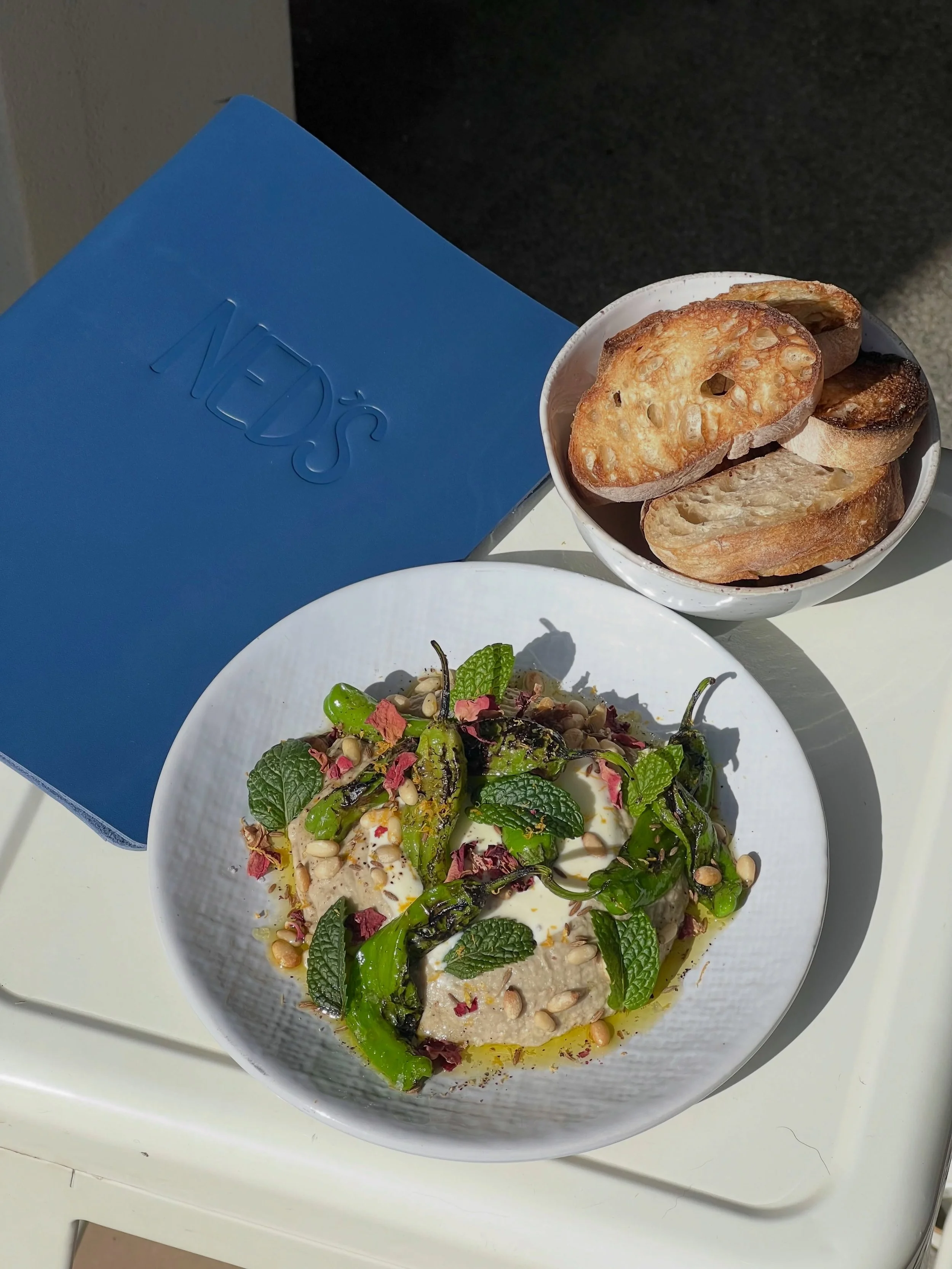 Baba Ganoush on the specials board this weekend. 

Charred shishito peppers, yoghurt vinaigrette, pine nuts, mint, orange zest &amp; rose, served with some toasted sourdough.