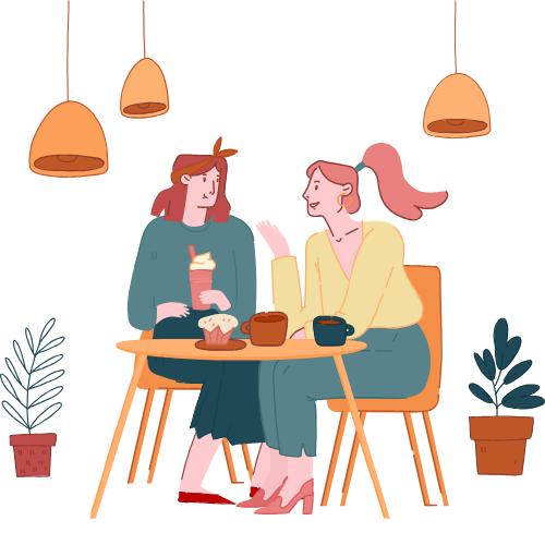 Deux femmes assises à une table de café, discutant. L'une tient un verre avec une paille, et il y a des cupcakes et des bols sur la table.