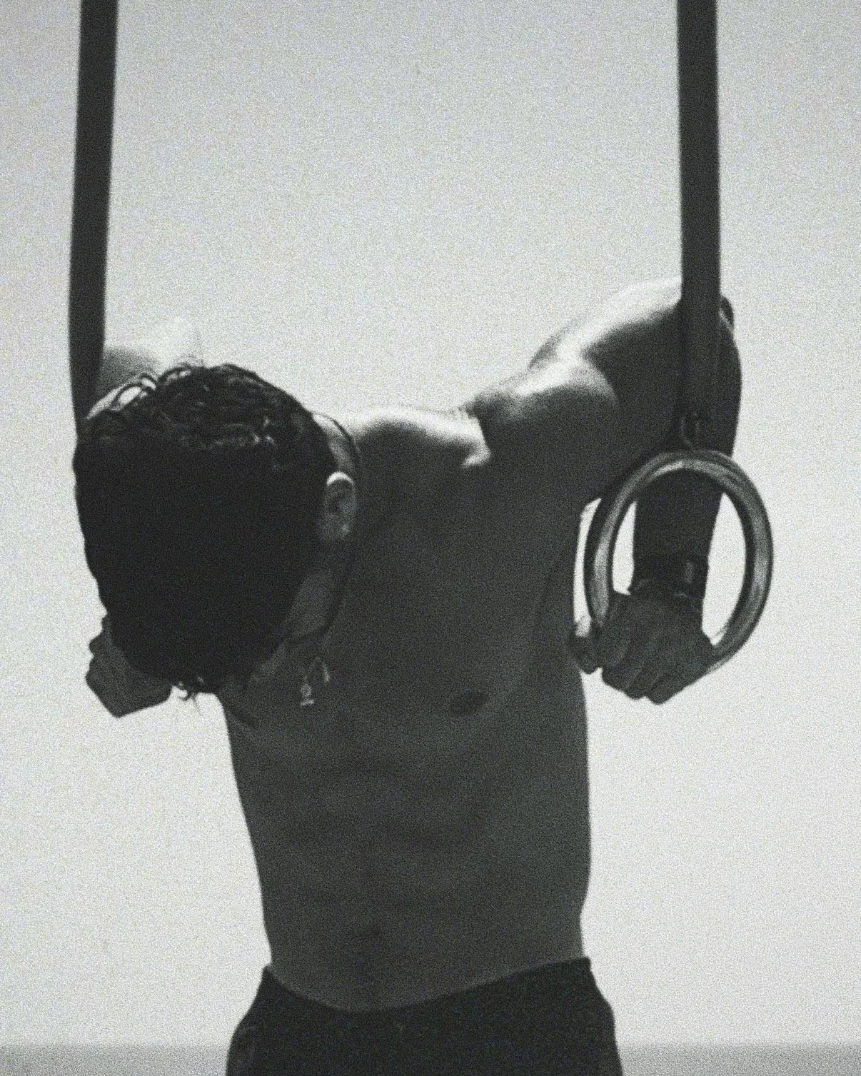 Victor performing calisthenics ring dips — Kharax functional training for strength, flexibility, and mental discipline in London.