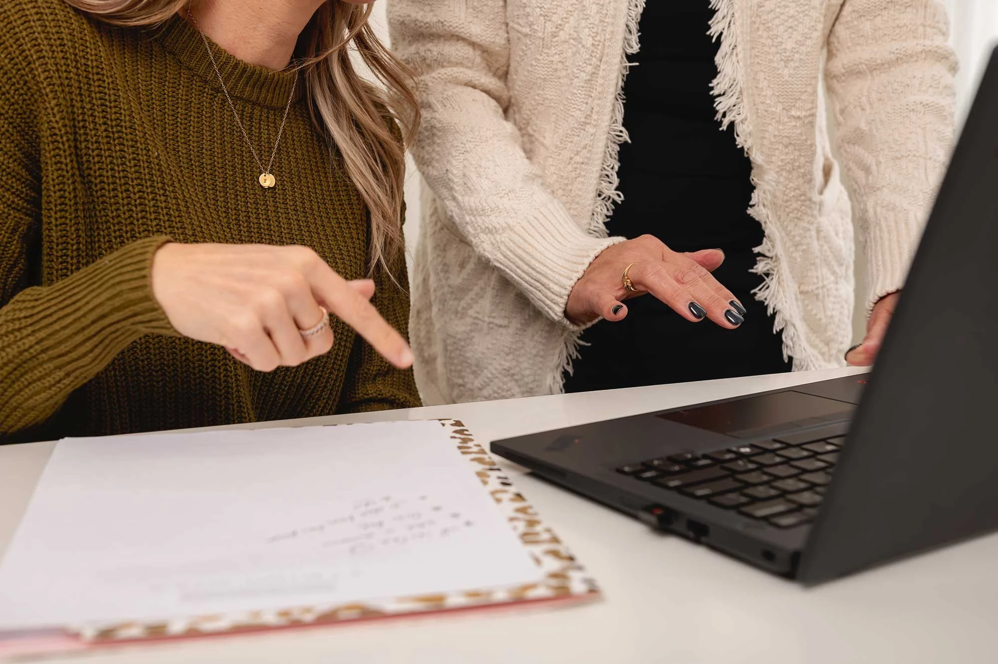 Tax advisors collaborating on tax planning and financial documents