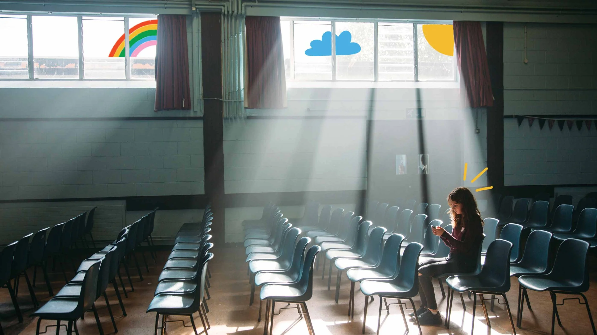 A girl sitting alone in a large, empty room with multiple rows of chairs. Sunlight streams through the windows, creating rays and casting shadows. Illustrations of a rainbow, cloud, and sun are added to the image.
