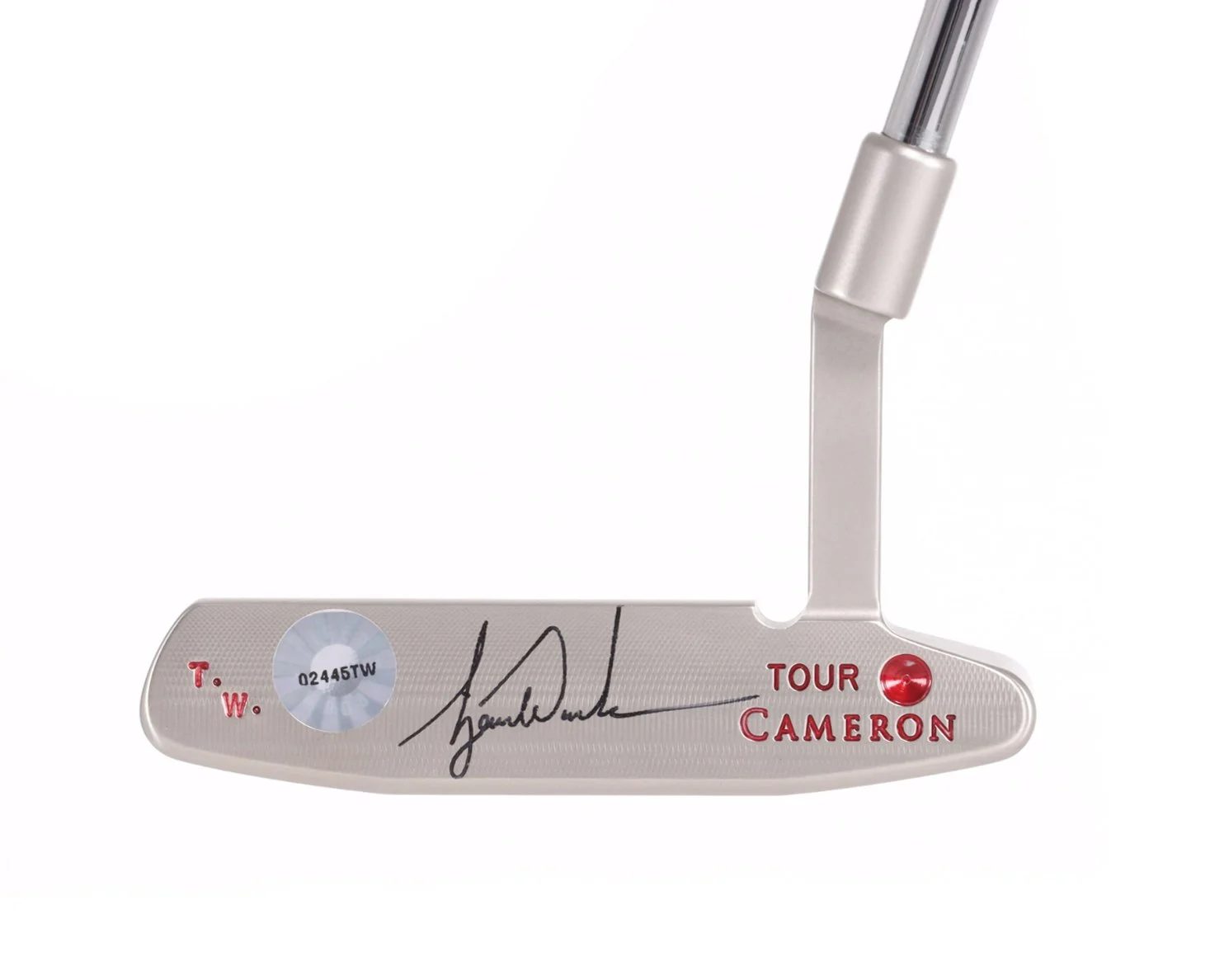 Close-up of a golf putter with a silver finish, signature, and the text 'TOUR CAMERON' in red. The putter has a connection to the golf legend Jack Nicklaus.
