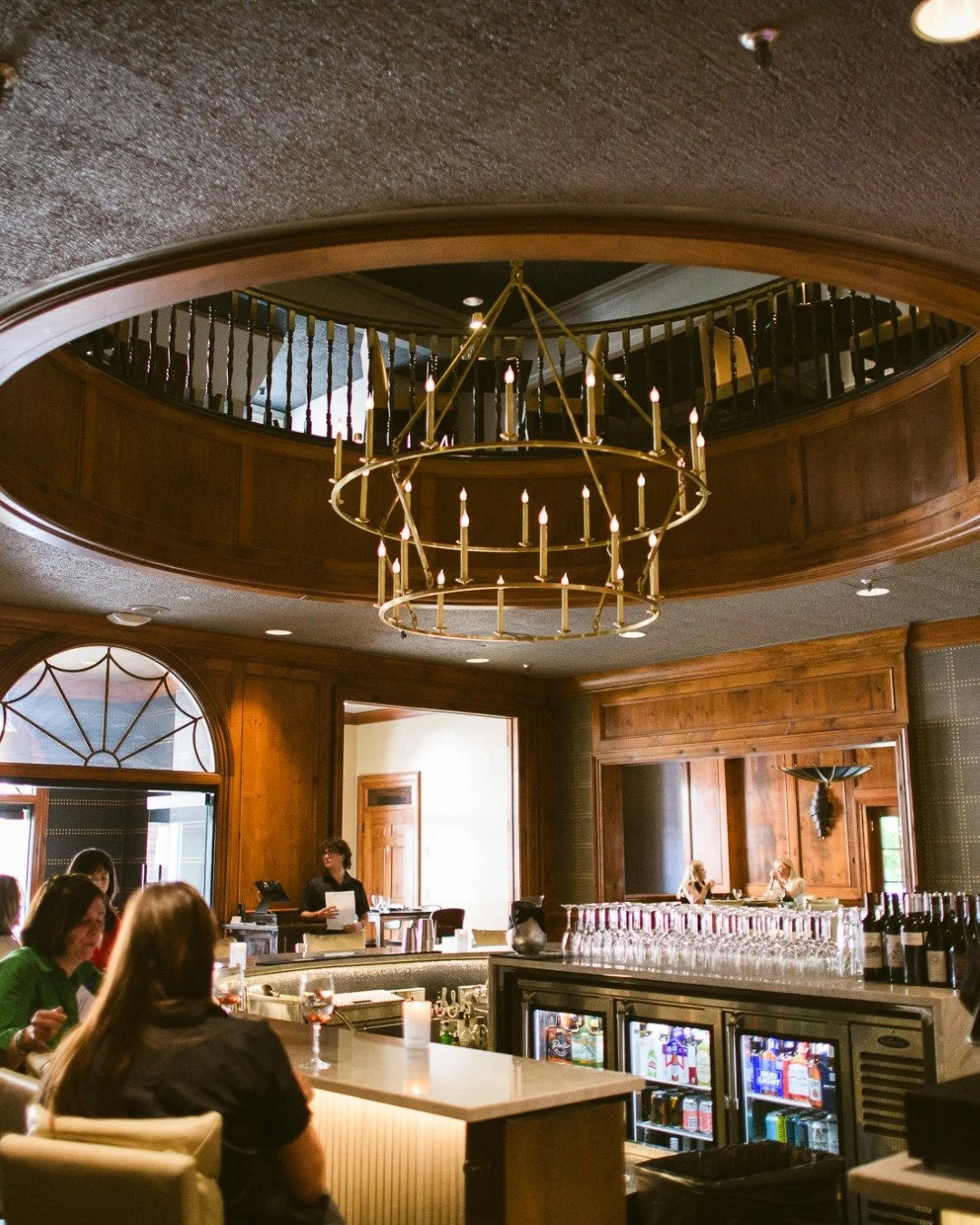 Some rooms just have a way of changing your pace. The glow off the wood, the hum from behind the bar, the quiet clink of glasses before the conversation builds.

This is where the evening finds its rhythm &mdash; relaxed but intentional, crafted but 