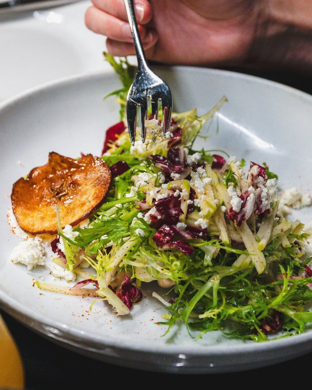 Apple &amp; Goat Cheese Salad &mdash; fris&eacute;e and radicchio for crunch and bitterness, fresh apple for snap, goat cheese for creaminess, pumpkin seeds for texture. Finished with an apple chip and caramel vinaigrette.

Straightforward, balanced,