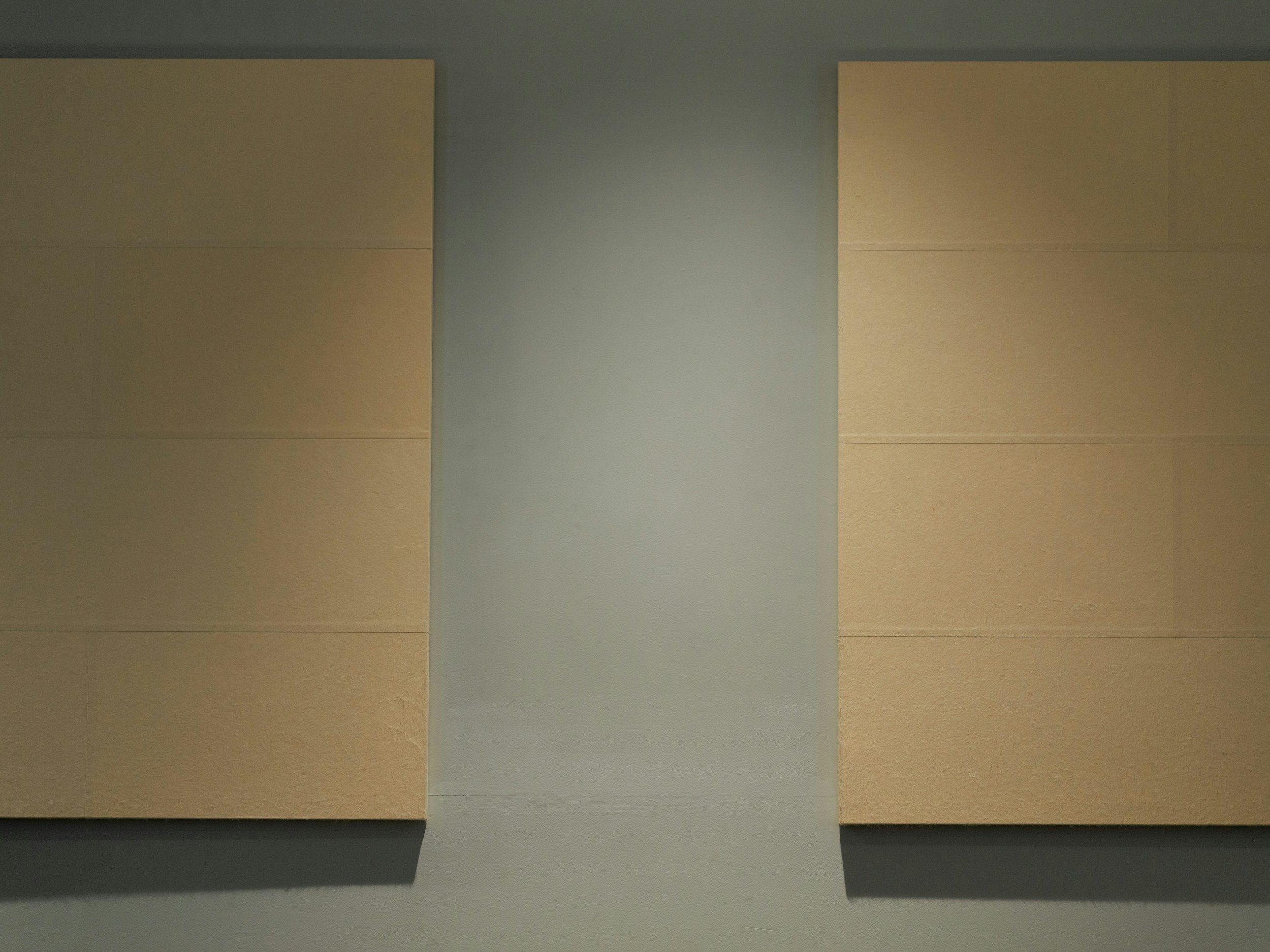 Fabric wrapped wall panels on a wall