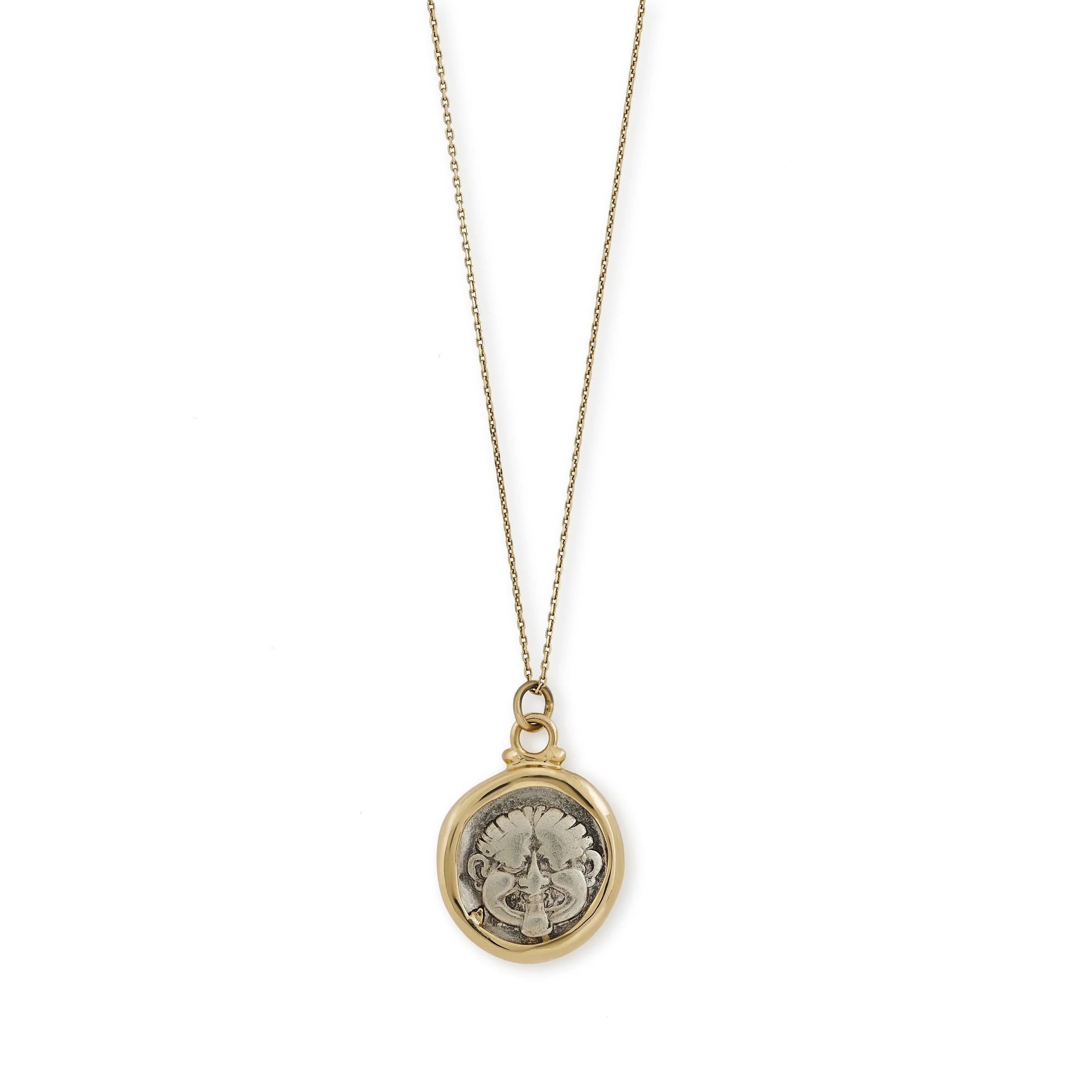 A Greek silver hemidrachm with Medusa set in a modern gold pendant