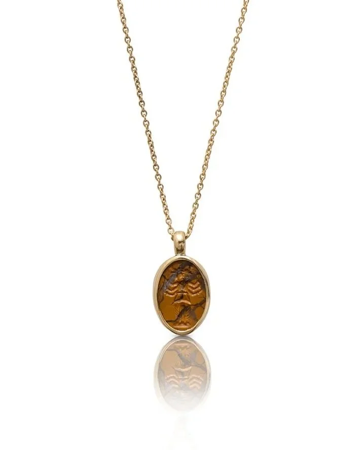A Roman yellow jasper intaglio of Hekate set in a modern gold pendant