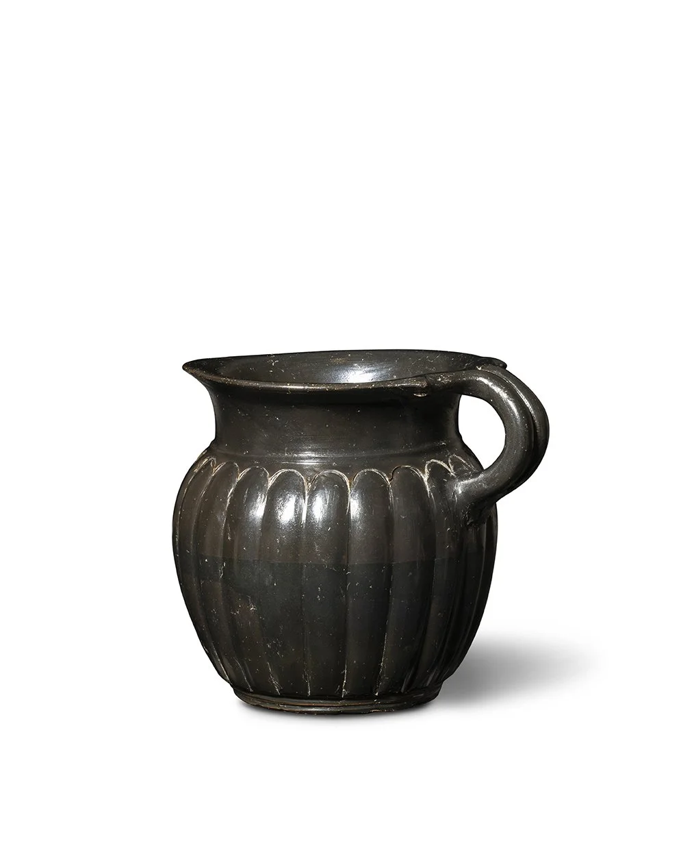 A Greek black-glazed mug