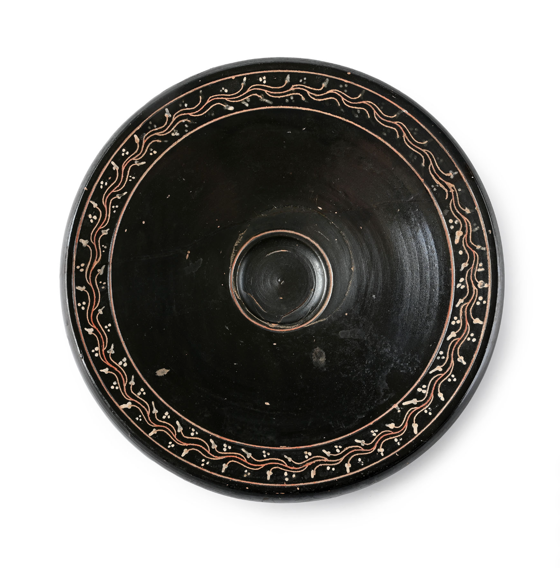 A large Greek black-glazed fish plate