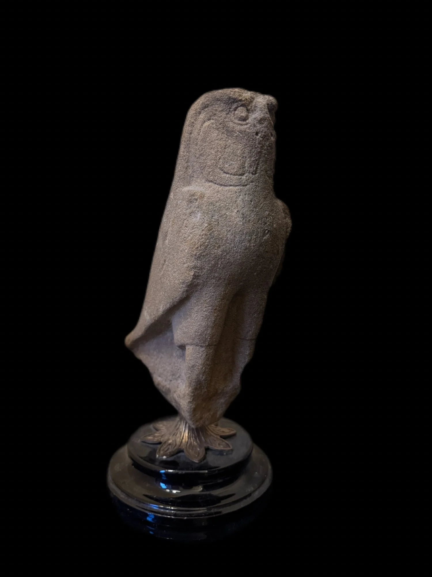 An Egyptian sandstone figure of Horus as a falcon