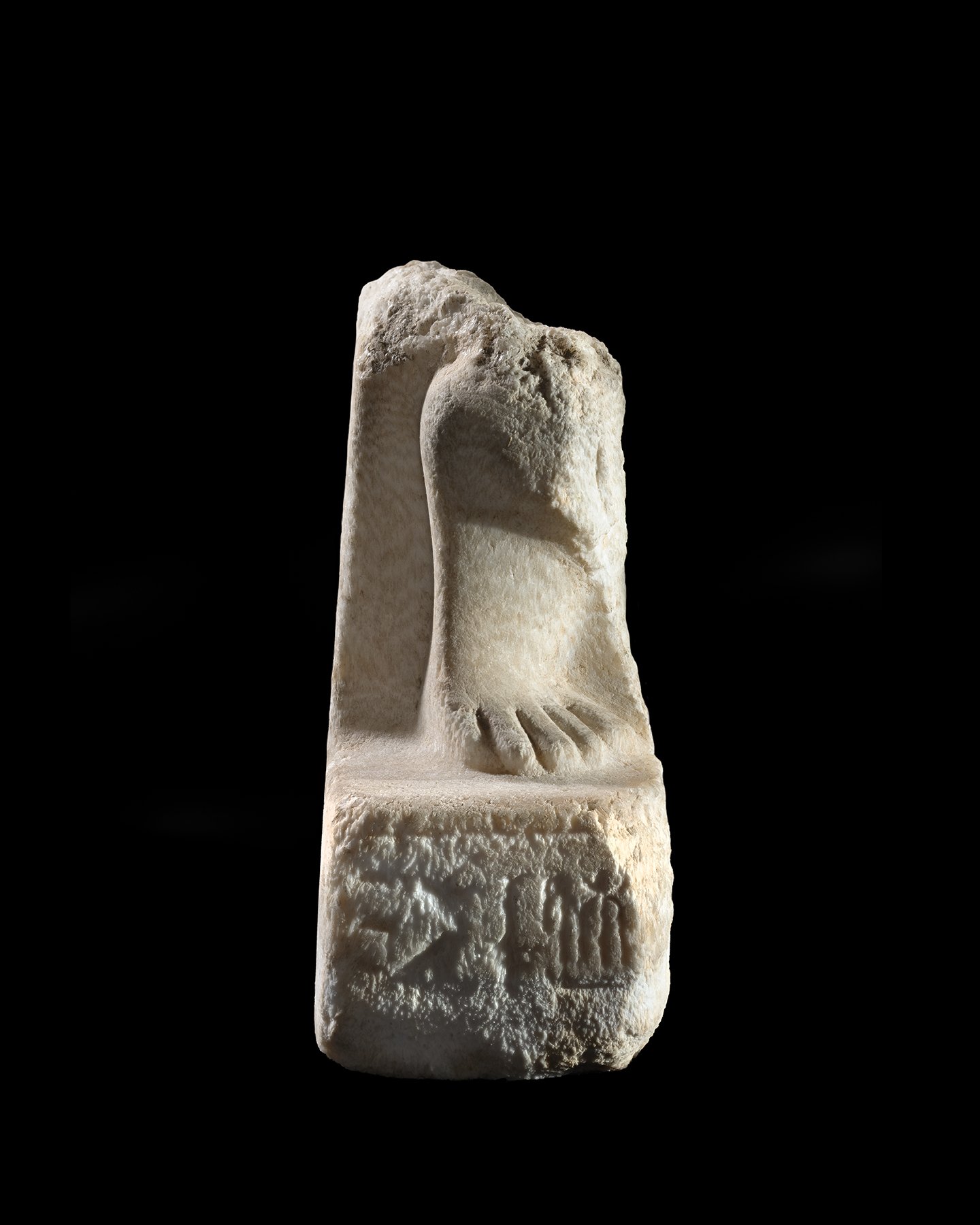 An Egyptian calcite statue fragment inscribed for Queen Nefertari