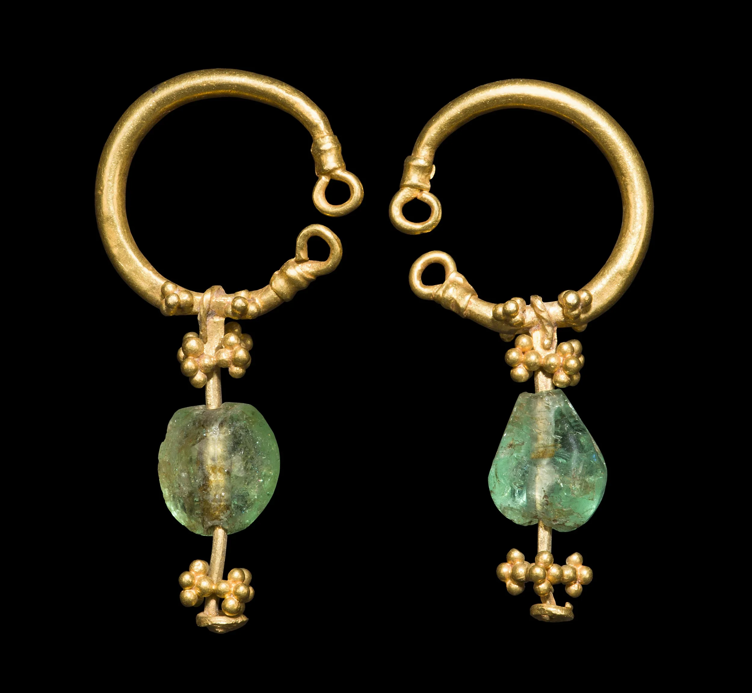 A pair of Islamic gold and emerald earrings