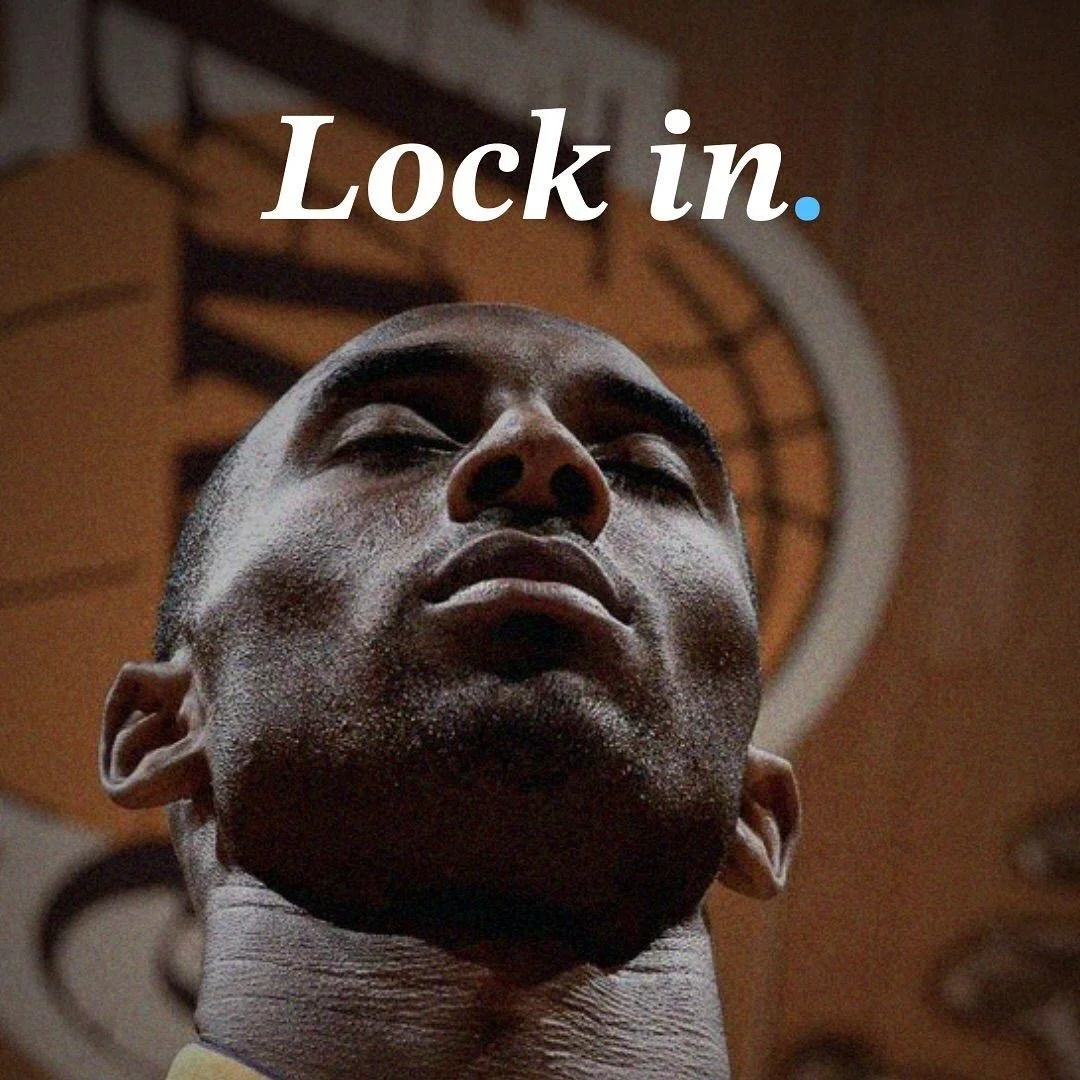 Close-up of a man's face from a low angle with the words 'Lock in.' written above.