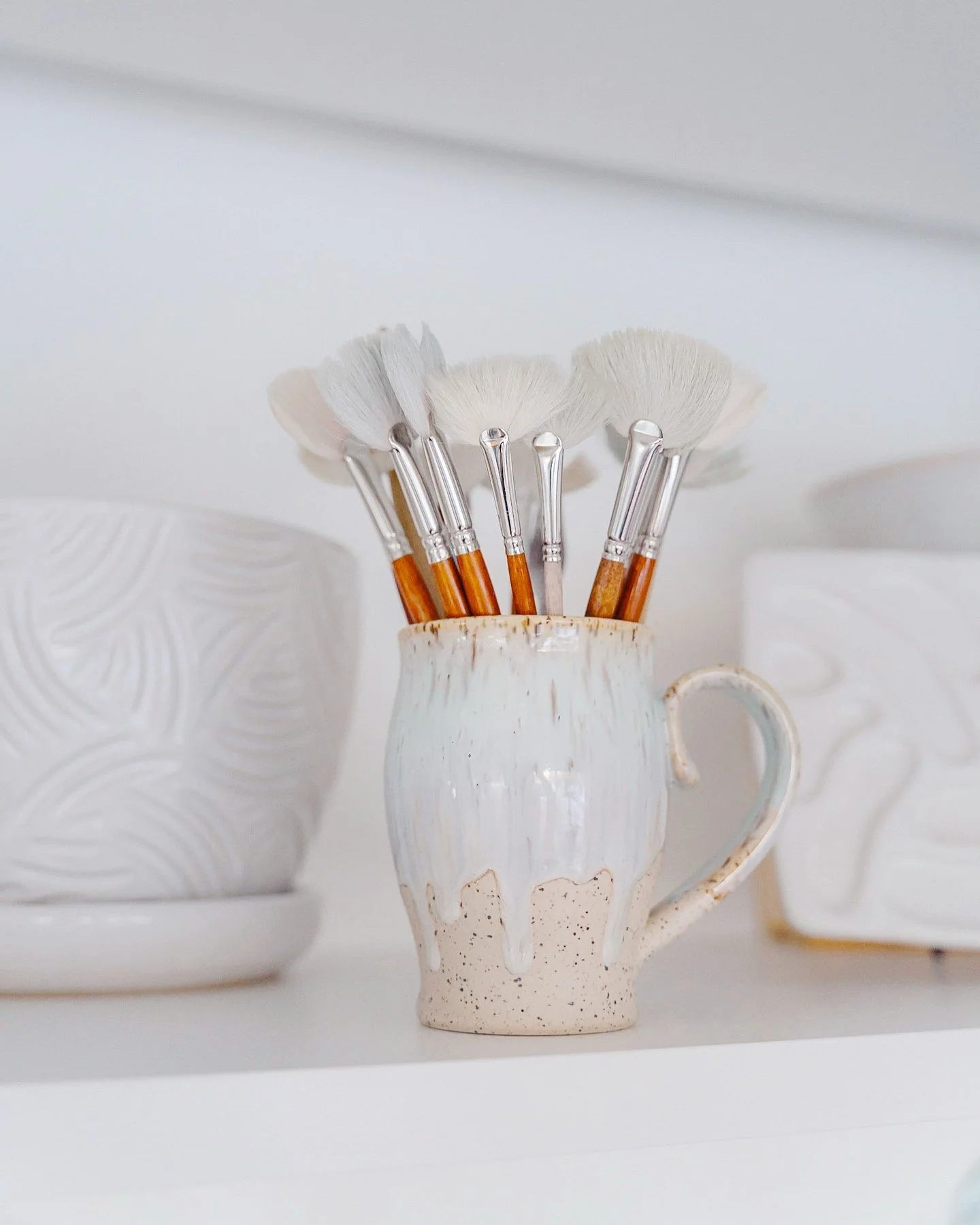 Ahh the beauty of a mug full of clean brushes waiting to be dipped into colorful jars of glaze! Don&rsquo;t clean glaze brushes look like an invitation to create something? Such a beautiful sight to me. It&rsquo;s been very quiet in the studio for th