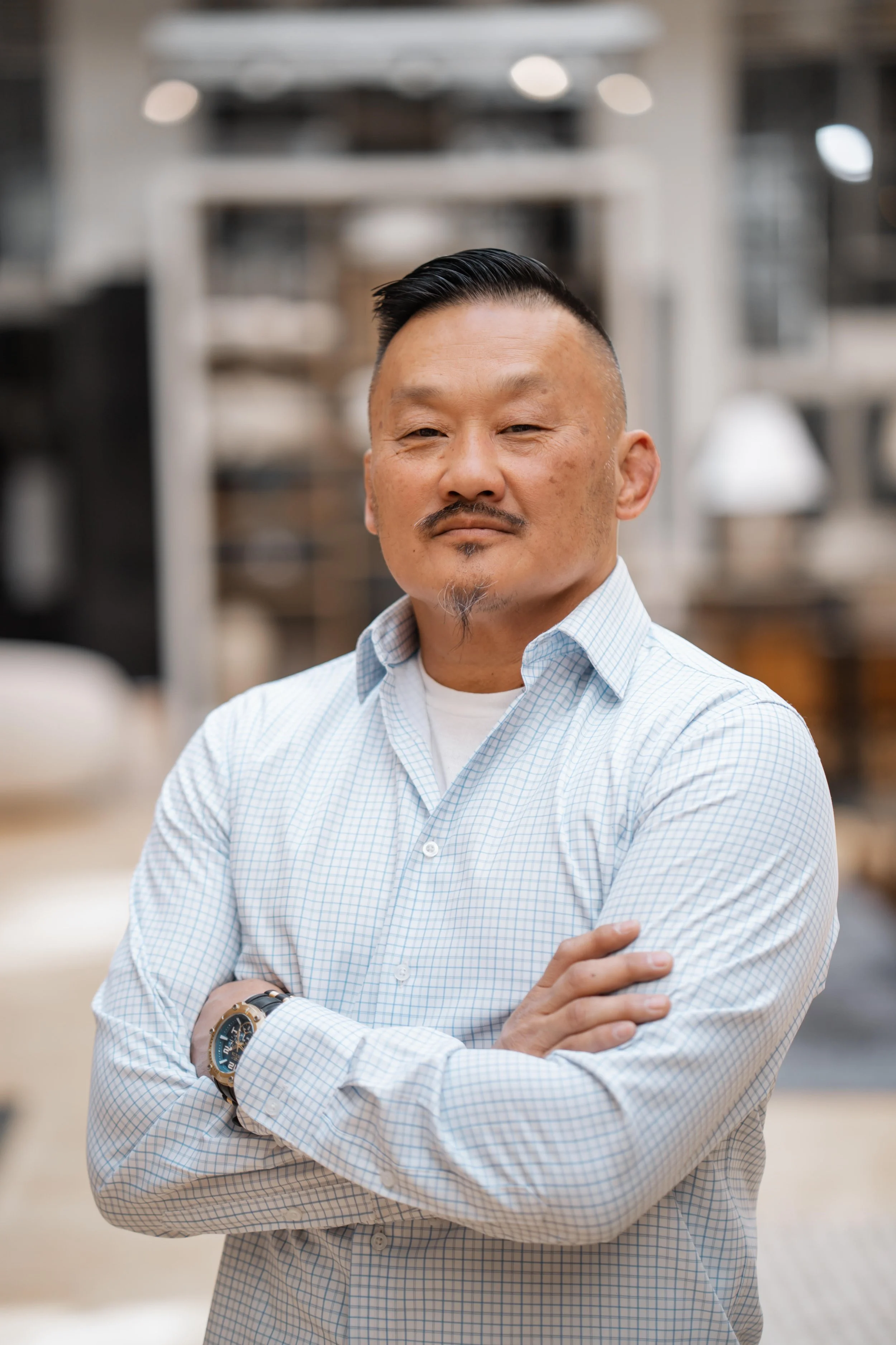 Northern Nevada real estate agent Jon Poole standing confidently with arms crossed.