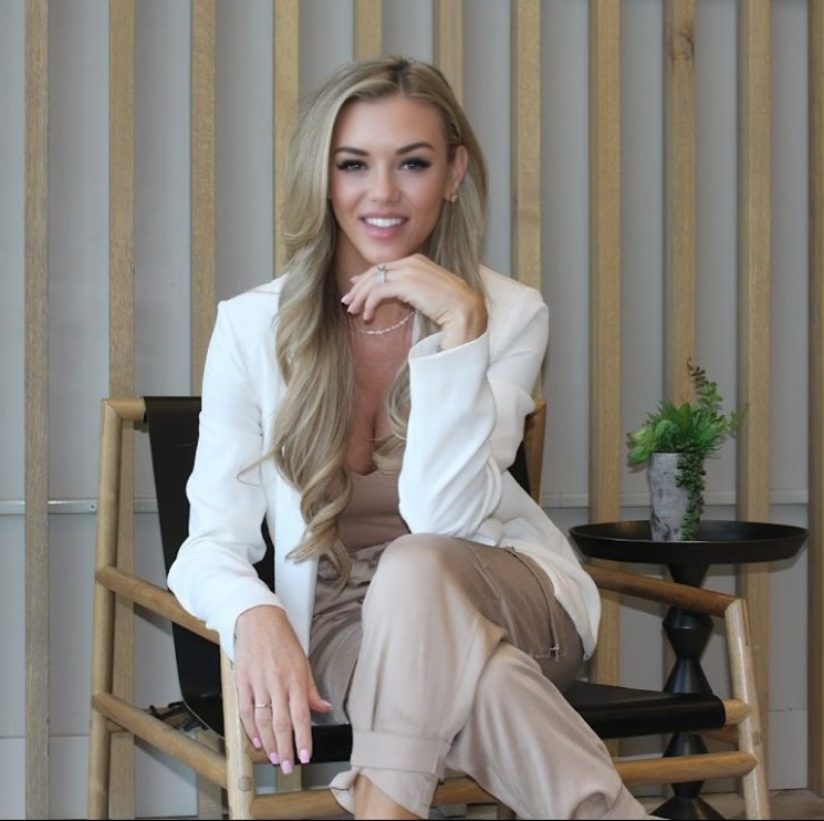 Becky Wishart, Northern Nevada mortgage expert, smiling in a modern office setting.