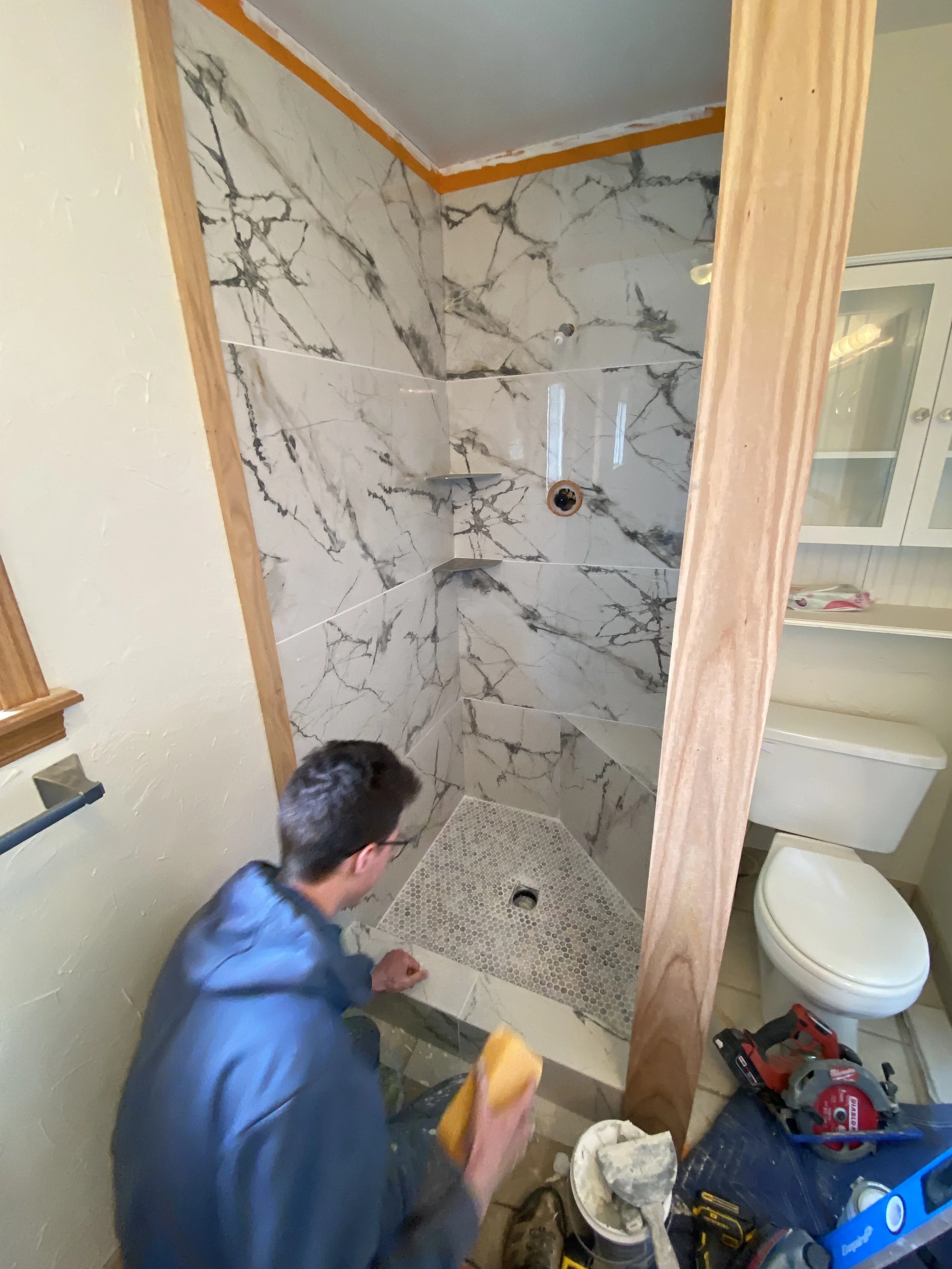 Finishing up the grout after tile installation