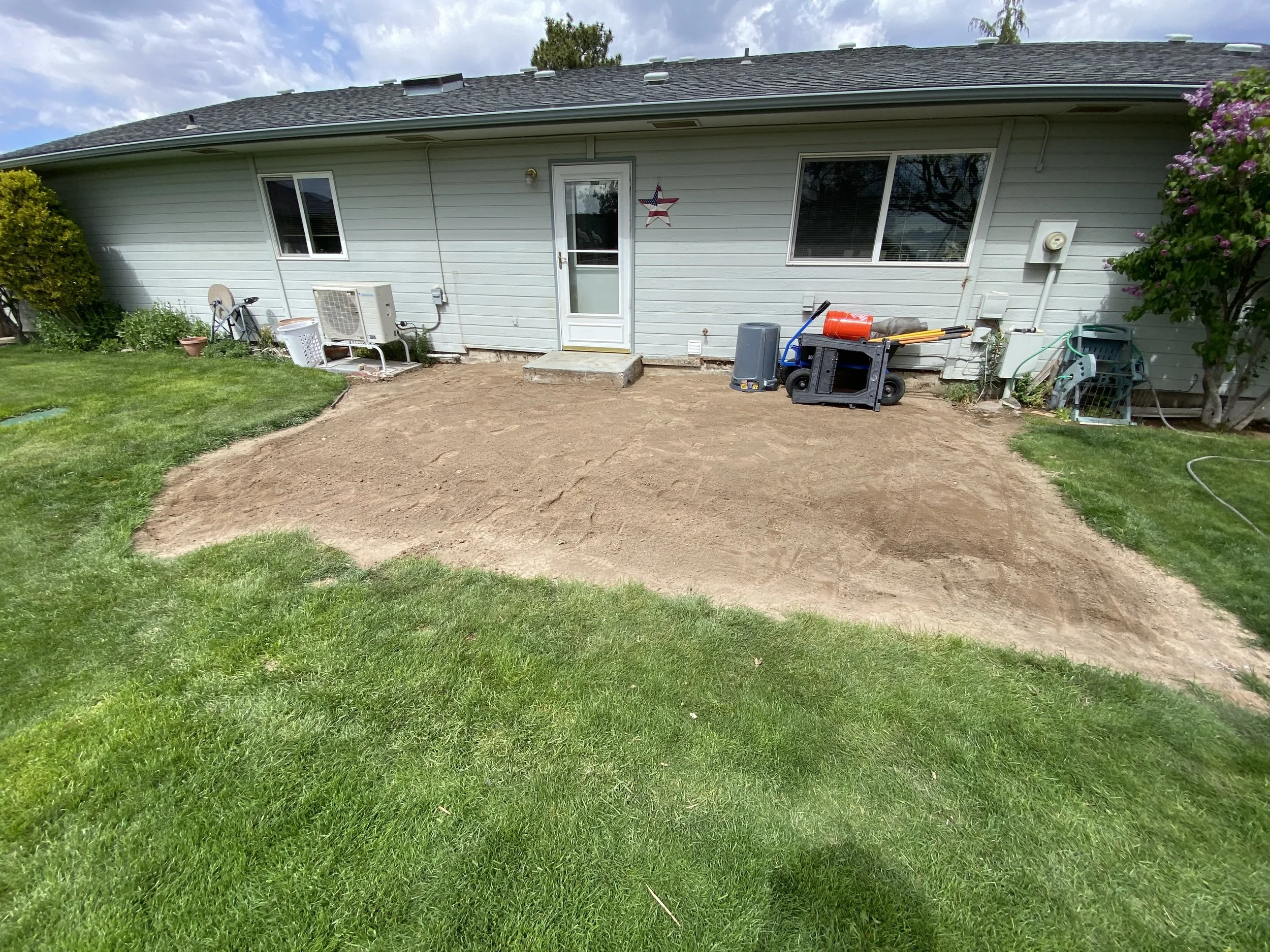 Removed old deck, leveled the ground, and getting ready to install ledger, foundation pads, and weed barrier