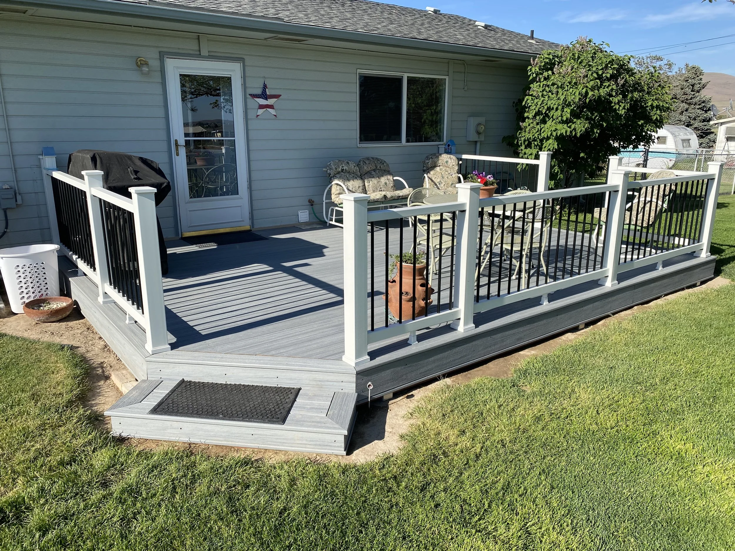 Completed deck with step and handrailing