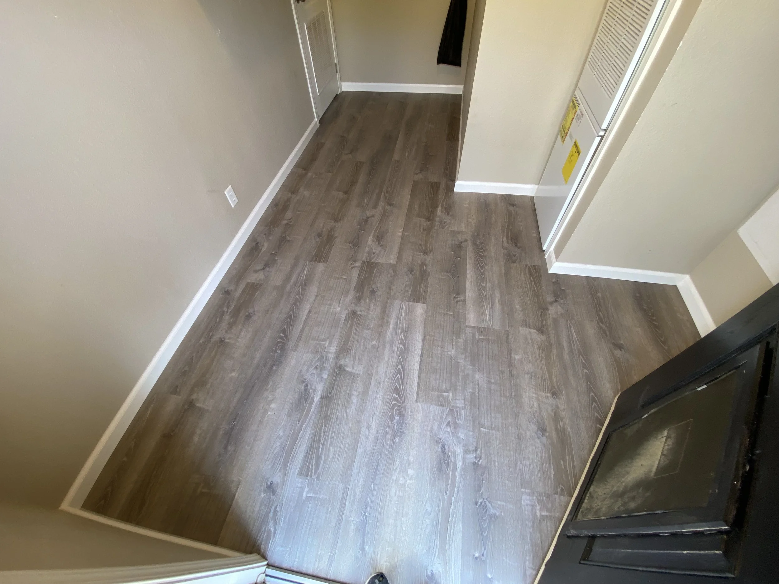 New floor and base trim installed (Little hard to tell from the photo, lighting makes if look kind of the same as the old floor) 