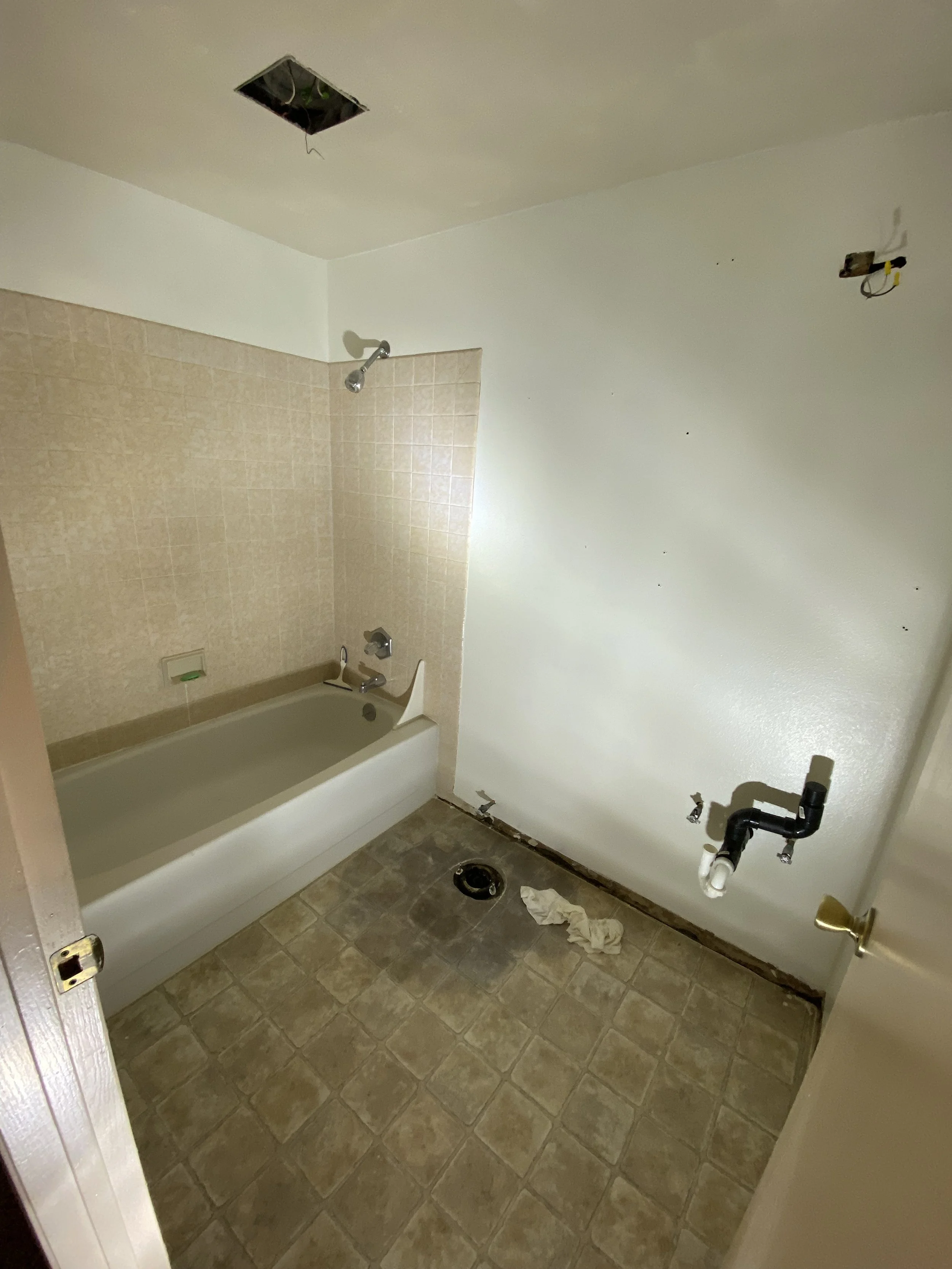 Removed old cabinets and toilet. Client wants new floor, trim, vanity, lightbar, vent, sink and cabinets. 