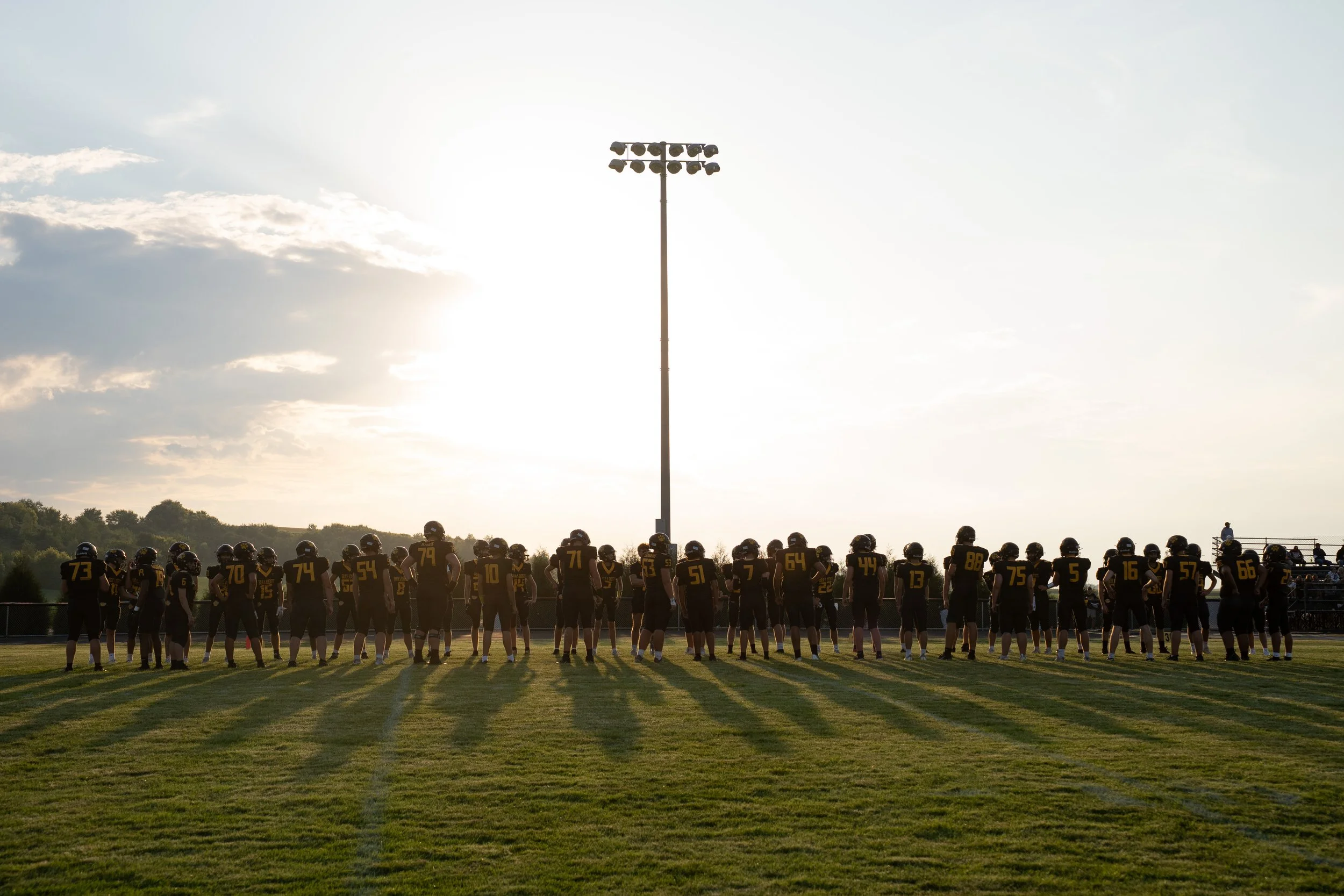 Plainview-Elgin-Millville football players line up to announce the starting lineup during a Southeast Central District football game between Lake City and Plainview-Elgin-Millville on Friday, Aug. 29, 2025 in Elgin. (Post Bulletin)