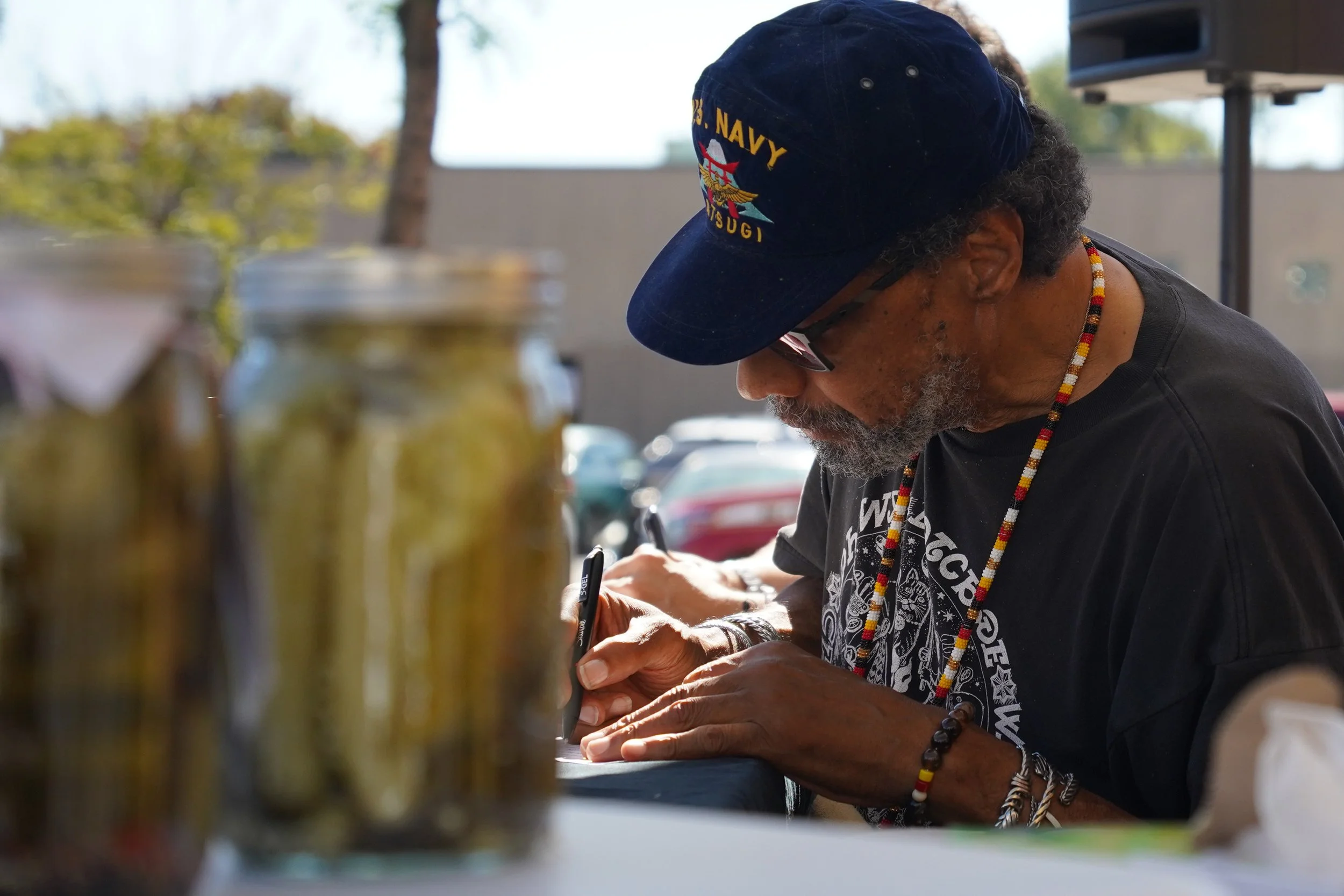Pickle-Off judge Joey Browner judges one of the pickle varieties submitted at the Third Annual Pickle-Off at the Four Sisters Farmer's Market in Minneapolis on Thursday, Sept. 26, 2024. at Four Sisters Farmers Market in Minneapolis on Thursday, Sept.