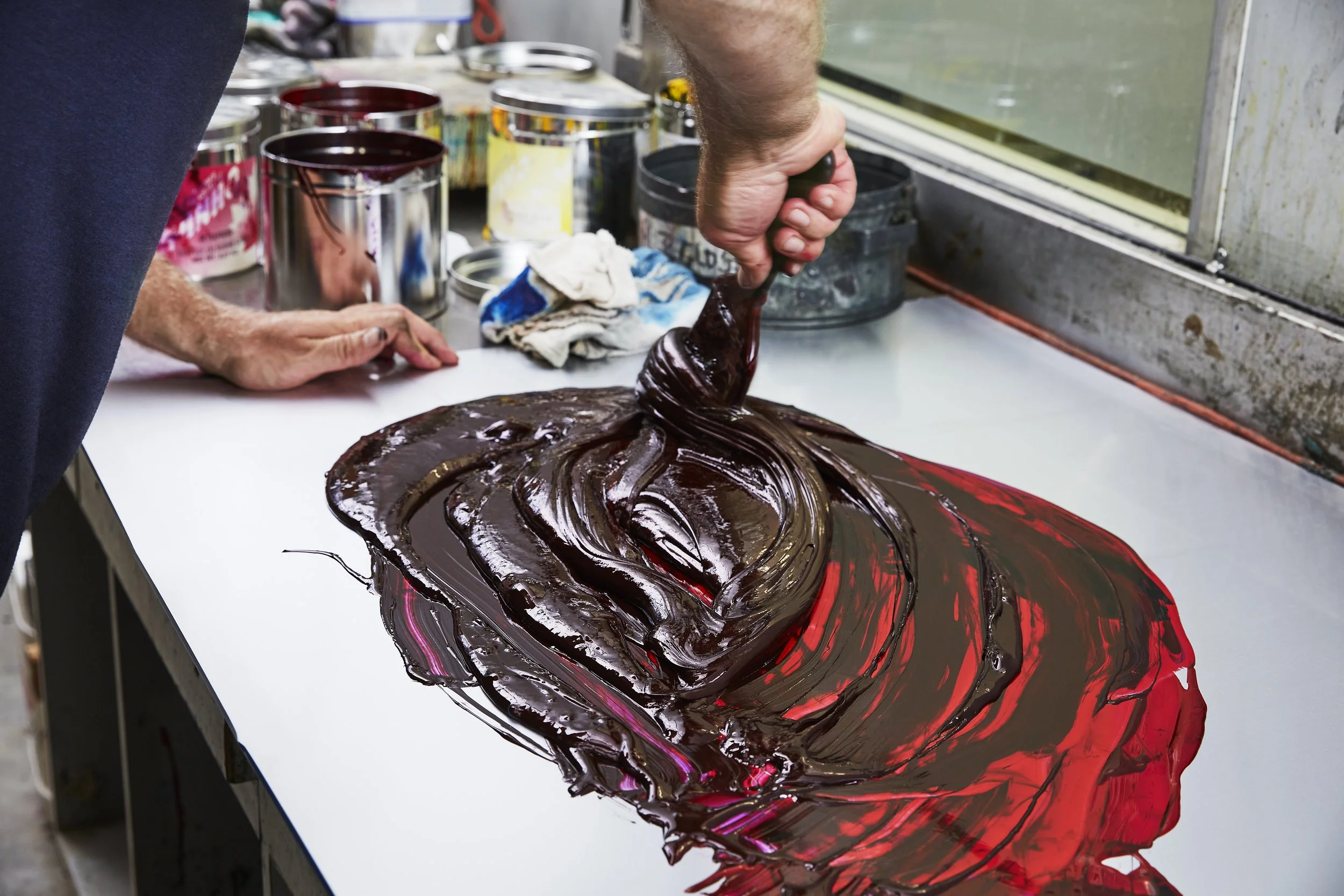 Art-directed brand photography for Proprint, capturing the hands-on process of mixing printing ink, highlighting the craftsmanship, precision and expertise behind the company's production capabilities. 