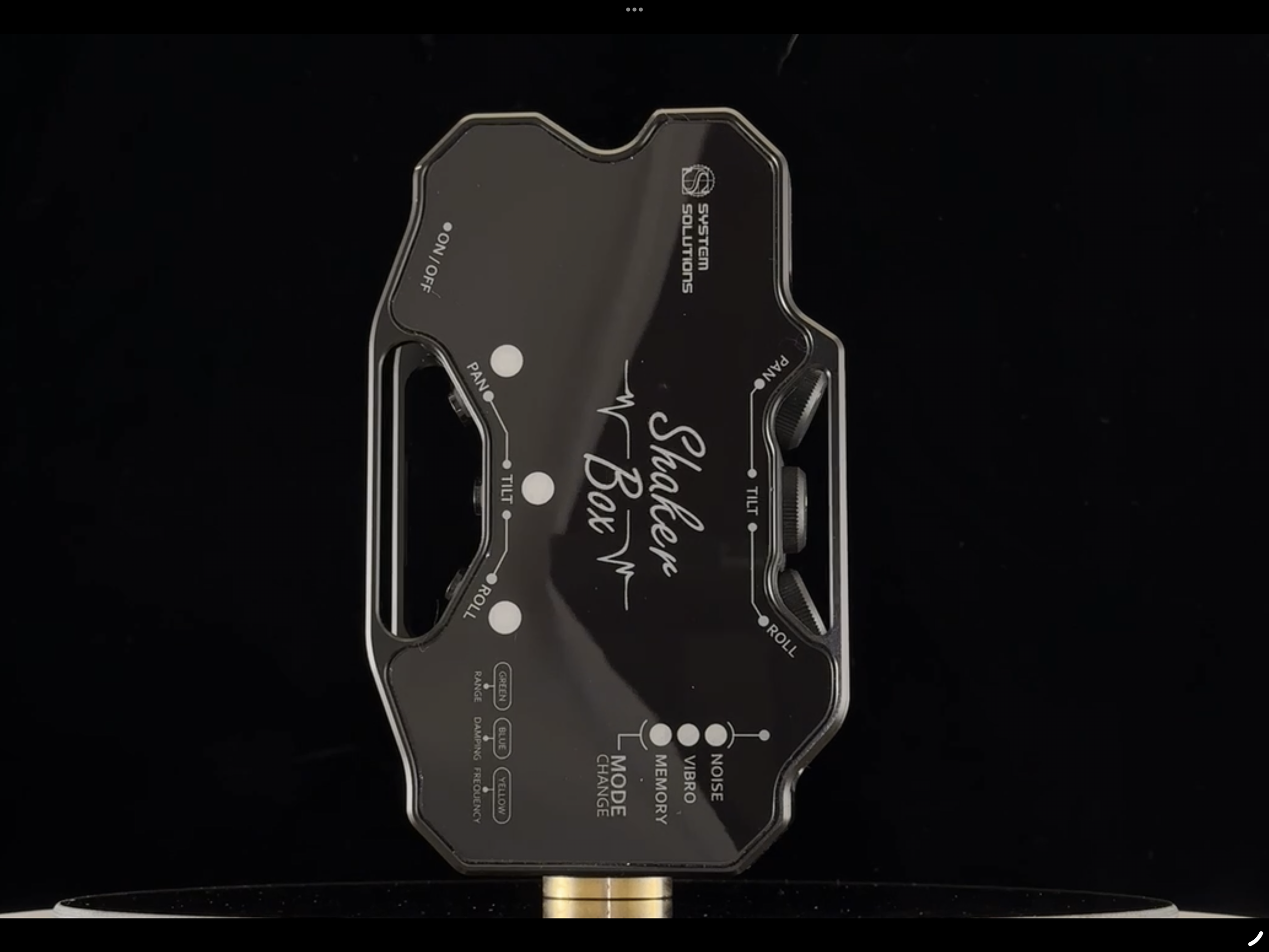 A black and gold audio equalizer device with multiple knobs and switches, labeled with functions like 'PAN,' 'TILT,' 'ROLL