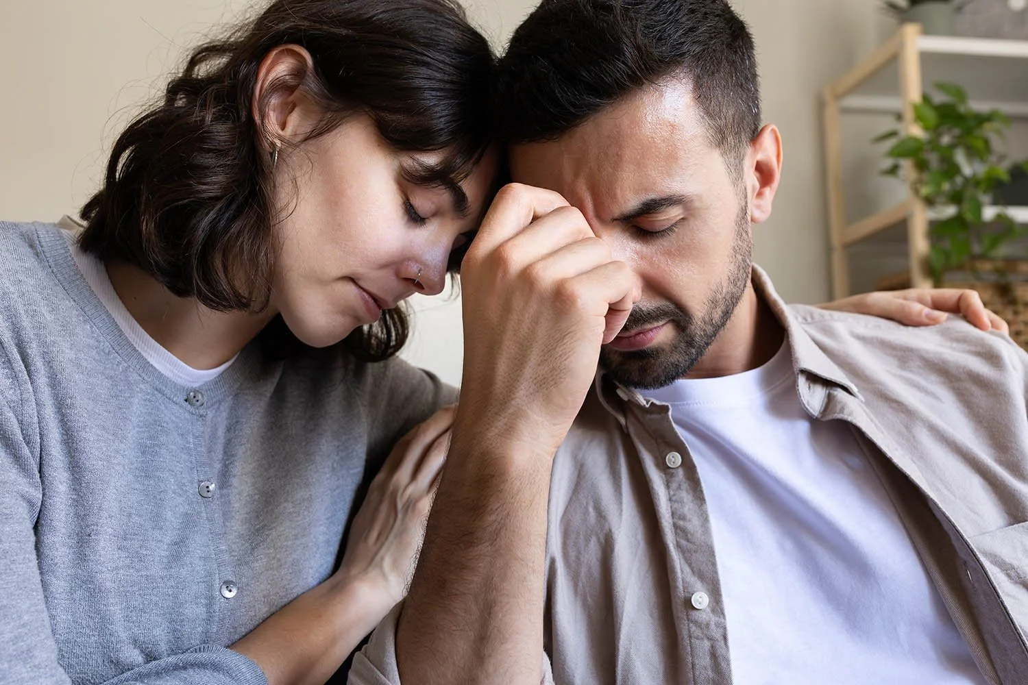 Woman comforting husband