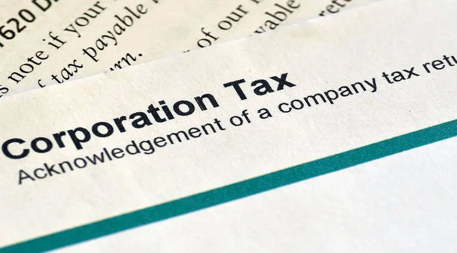 Tax advisor preparing corporation tax returns in line with UK and international regulations.