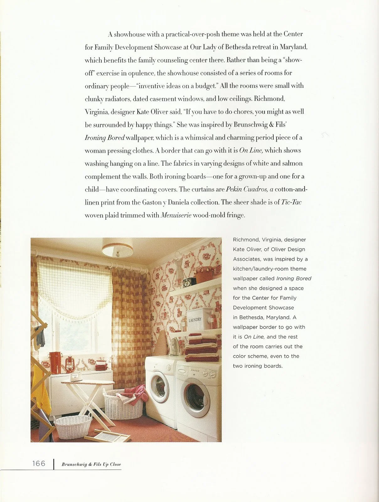 Photo of a laundry room with a window, patterned curtains, washing machines, shelves, laundry supplies, a laundry basket, stacked towels, and a wall decorated with patterned wallpaper.
