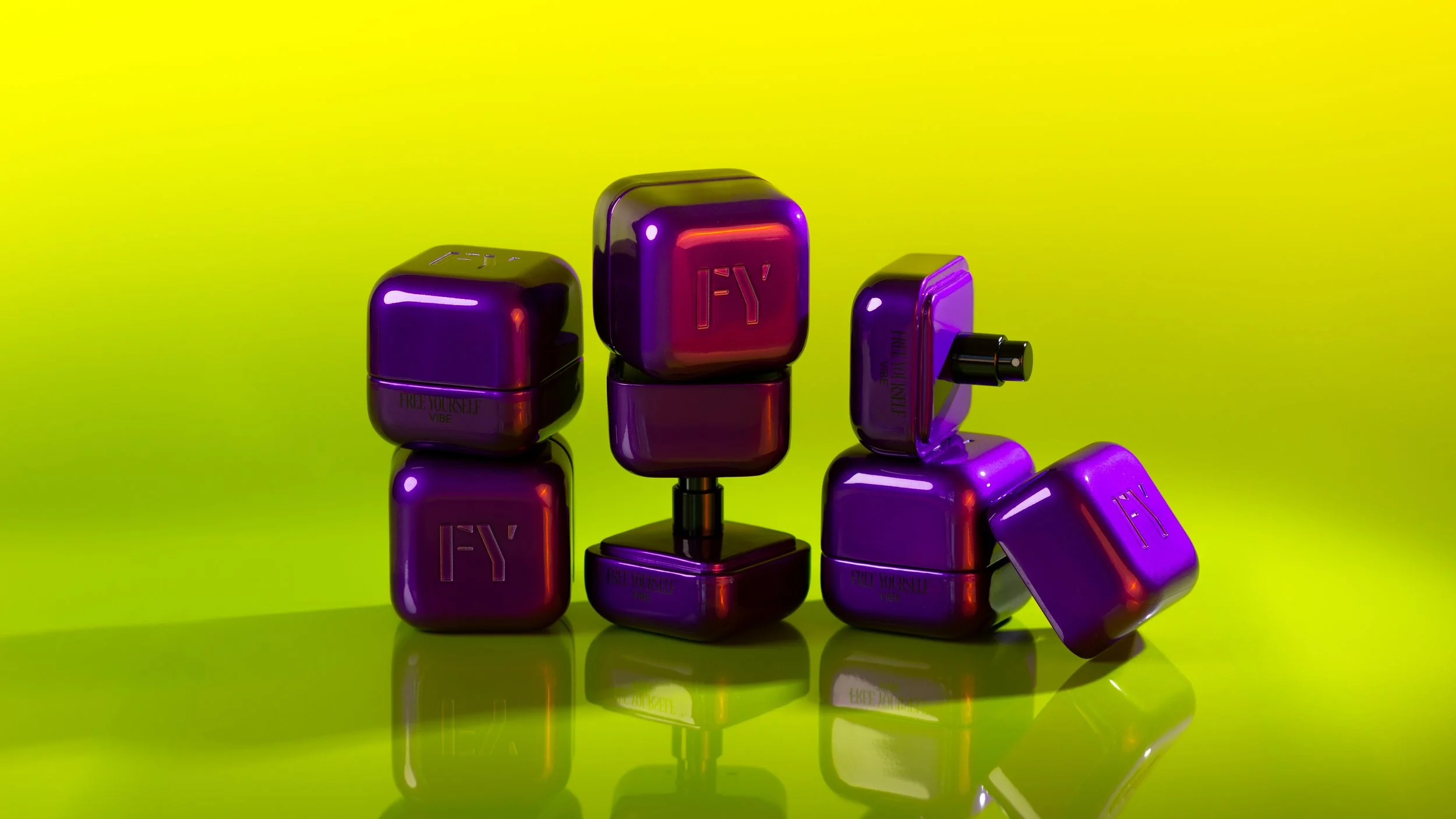 Multiple purple and black cosmetic containers with reflective surfaces arranged on a reflective green surface against a bright yellow background.