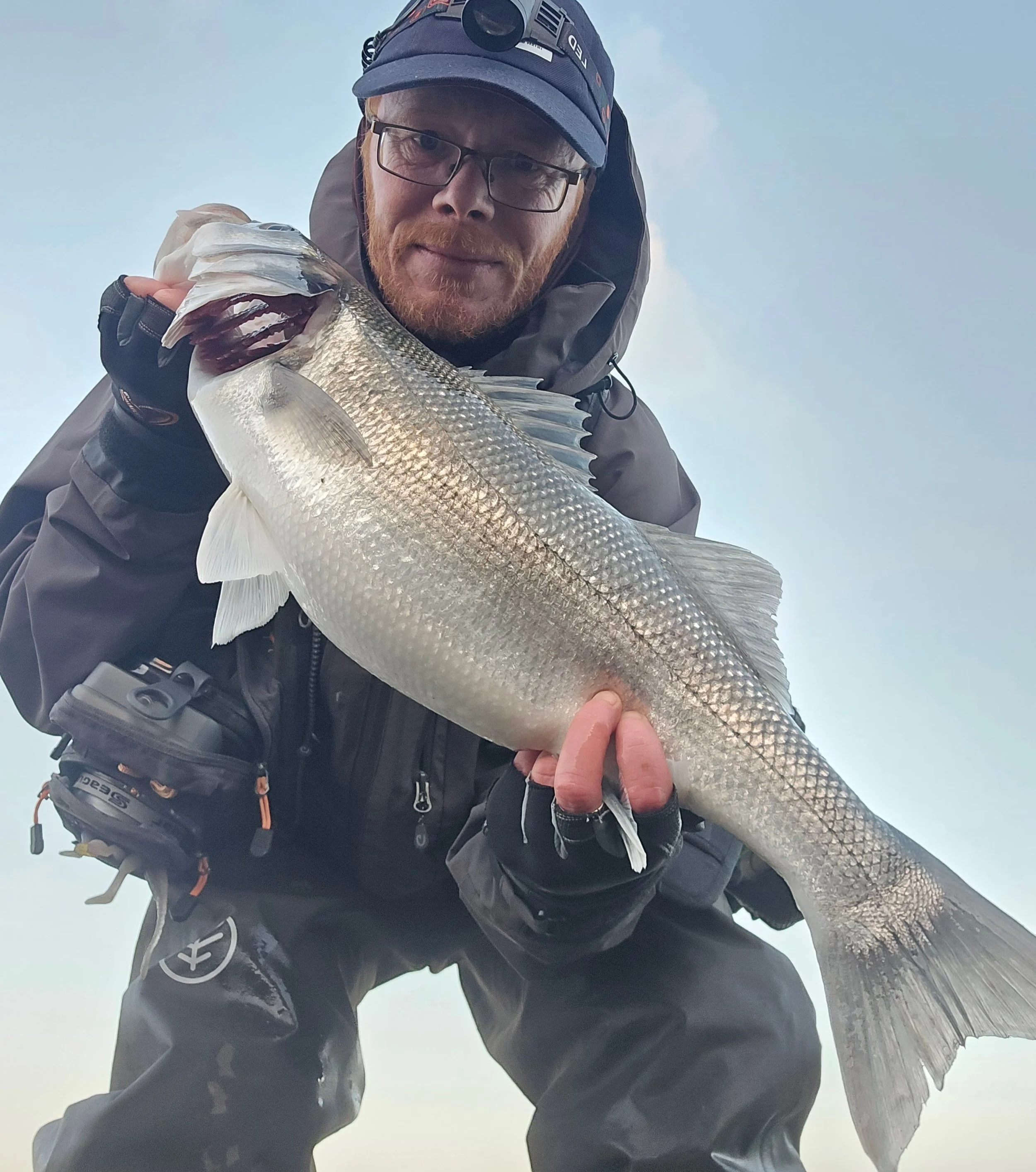Dave Power with 64cm early season bass caught on Pirate Lures Teaser on the Wexford coast Ireland.jpg