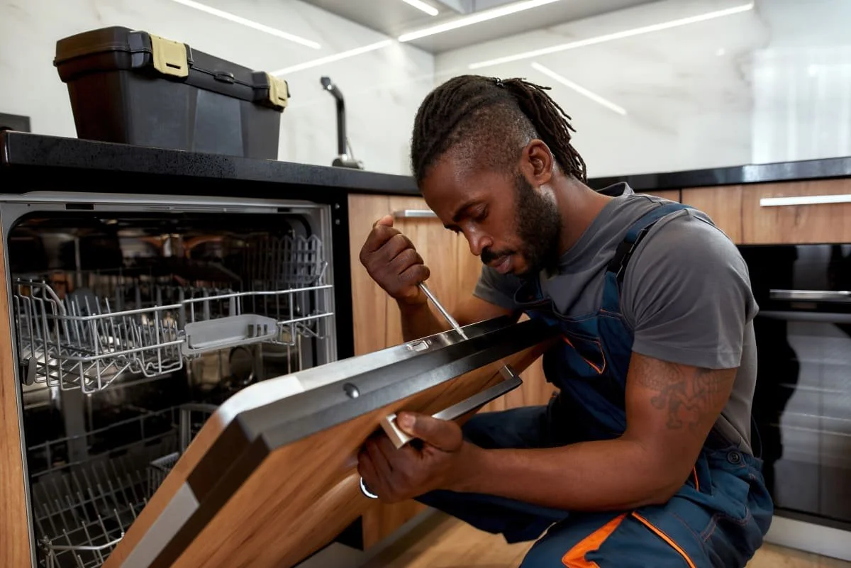 man-fixing-dishwasher.jpg