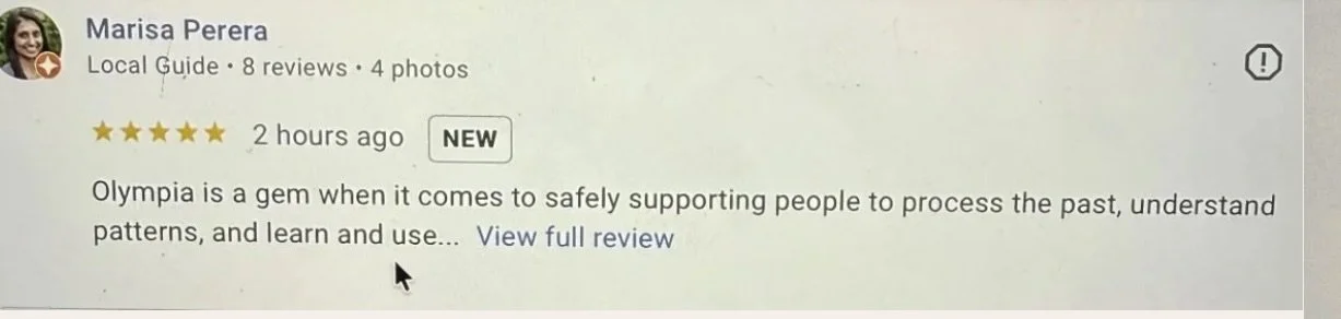 Google review by Marisa Perera. The review mentions Olympia as a supportive gem for understanding past patterns and learning.