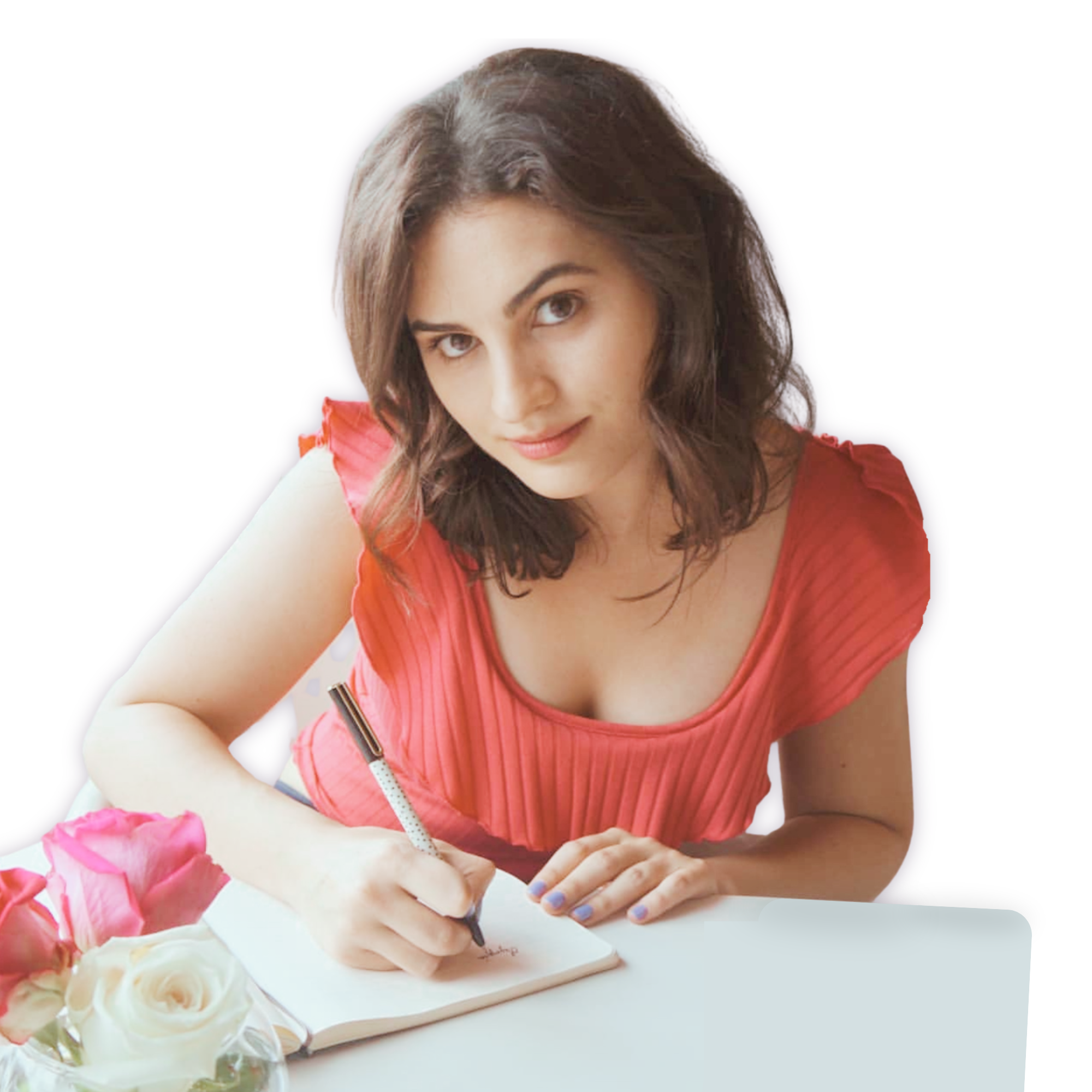 Olympia Georgeson sitting at a table, writing in a notebook with a pen transparent background.