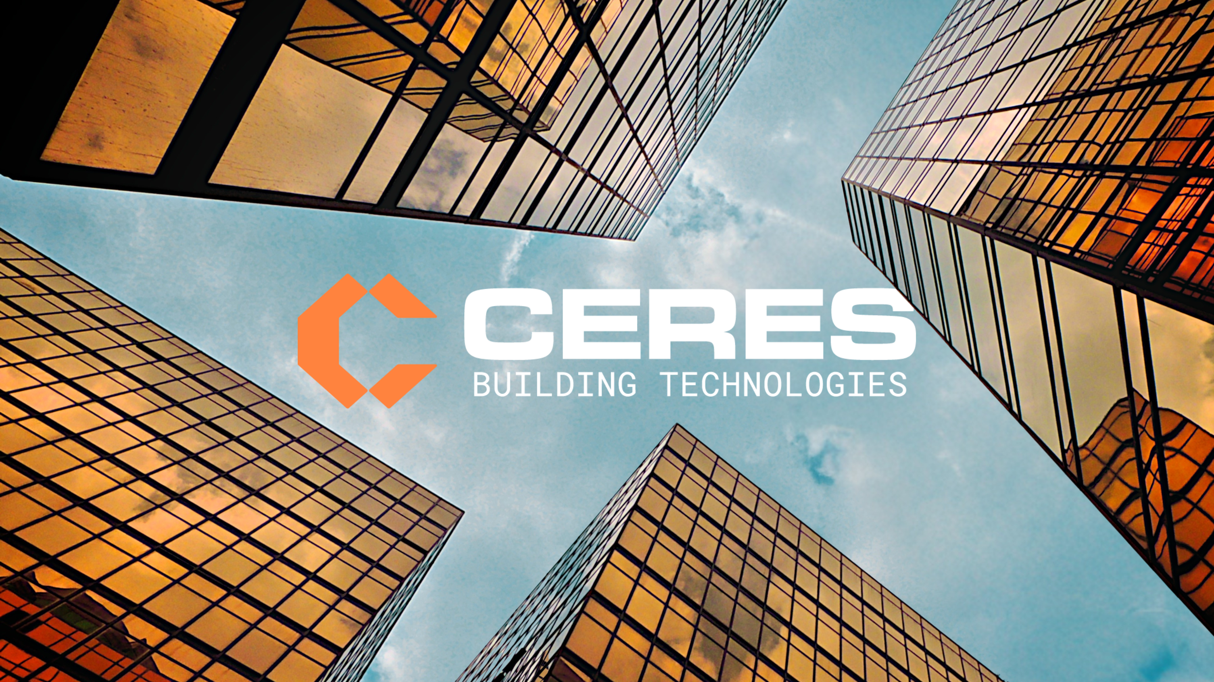 View looking up at modern glass office buildings with reflections, with the sky in the background. Overlaid text reads 'Ceres Building Technologies' with a logo featuring an orange geometric shape.