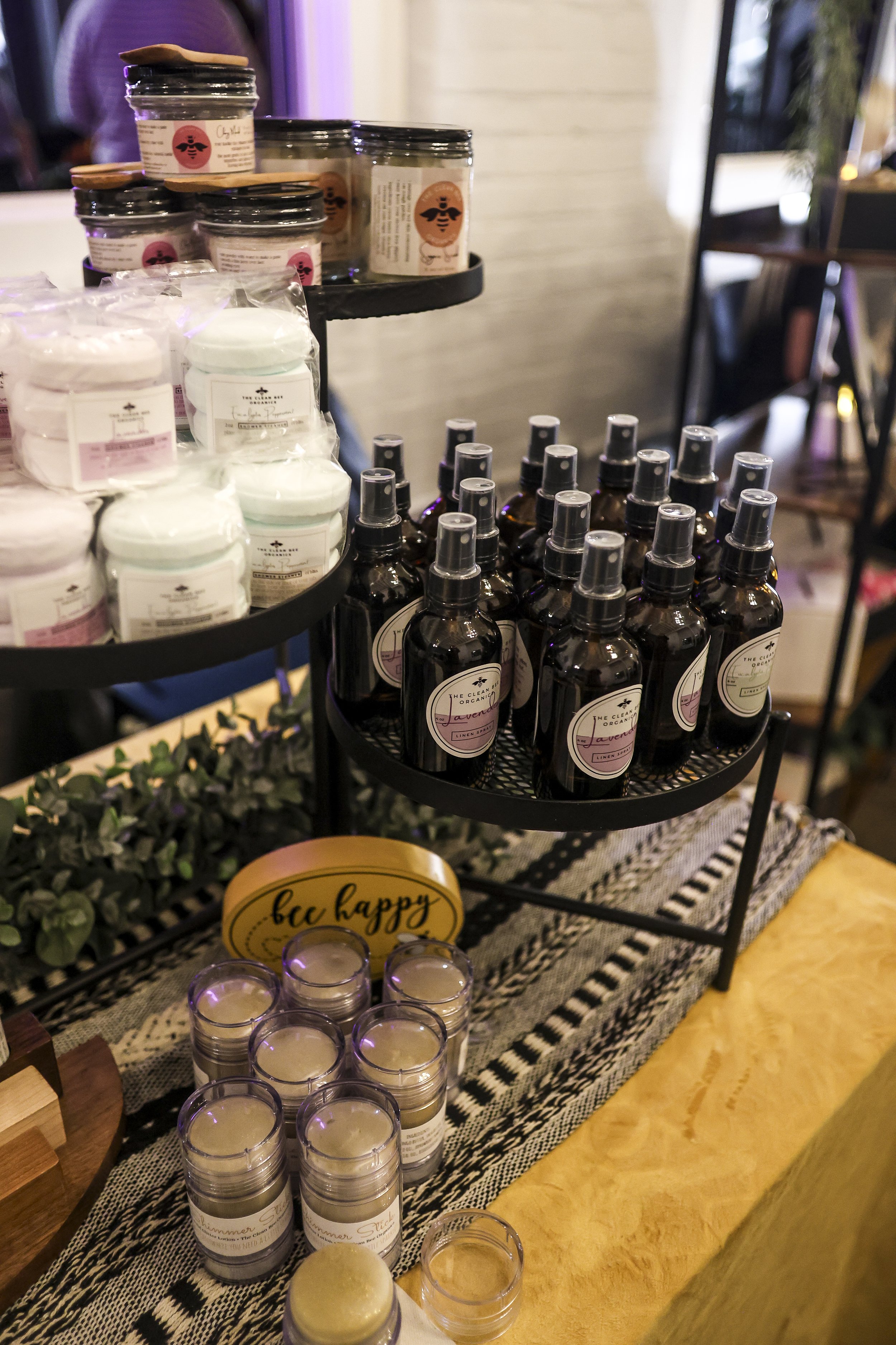 market display of lotion bars, shower steamers, linen sprays, glitter sticks