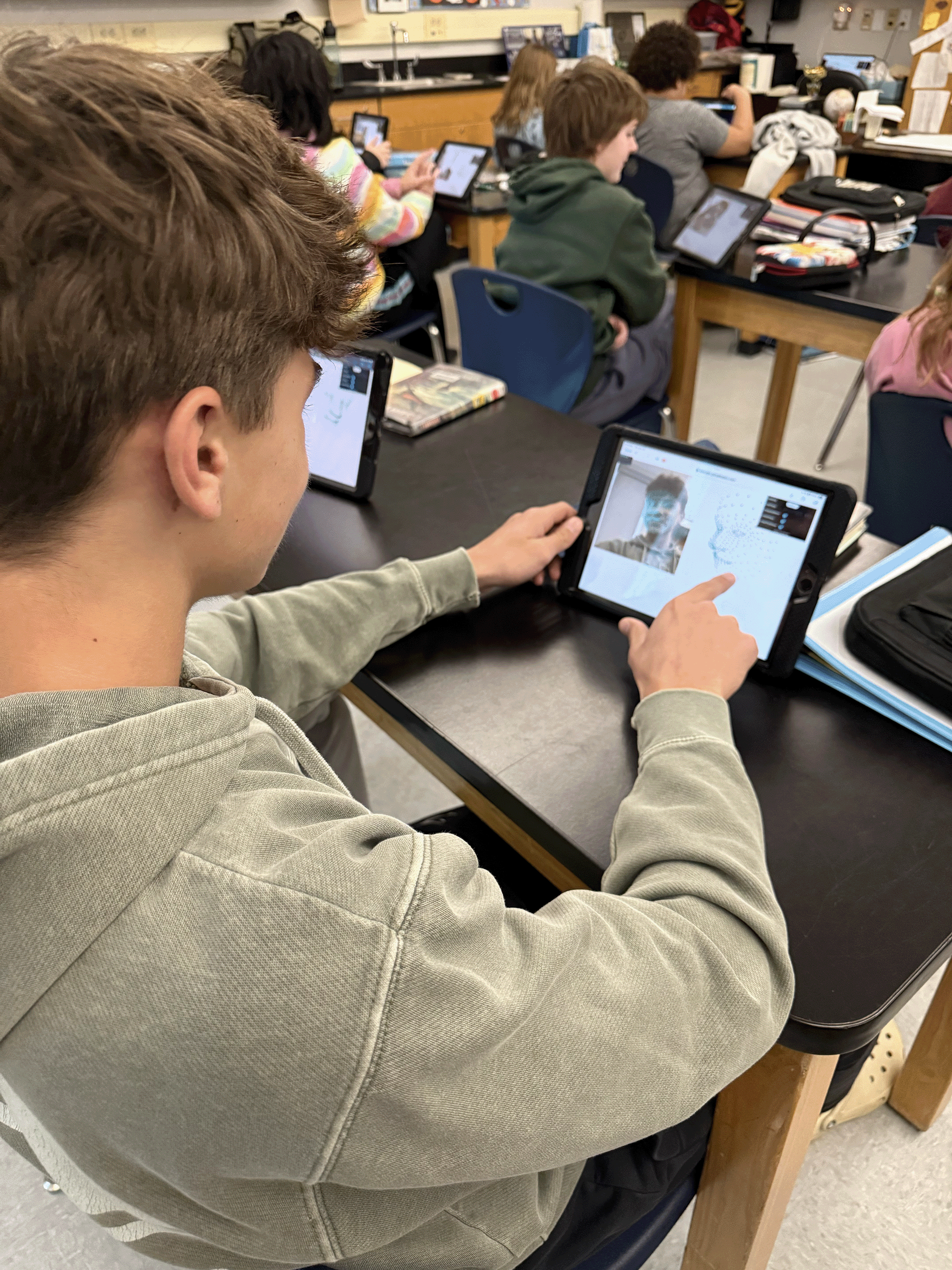 Student working at a computer programming AI