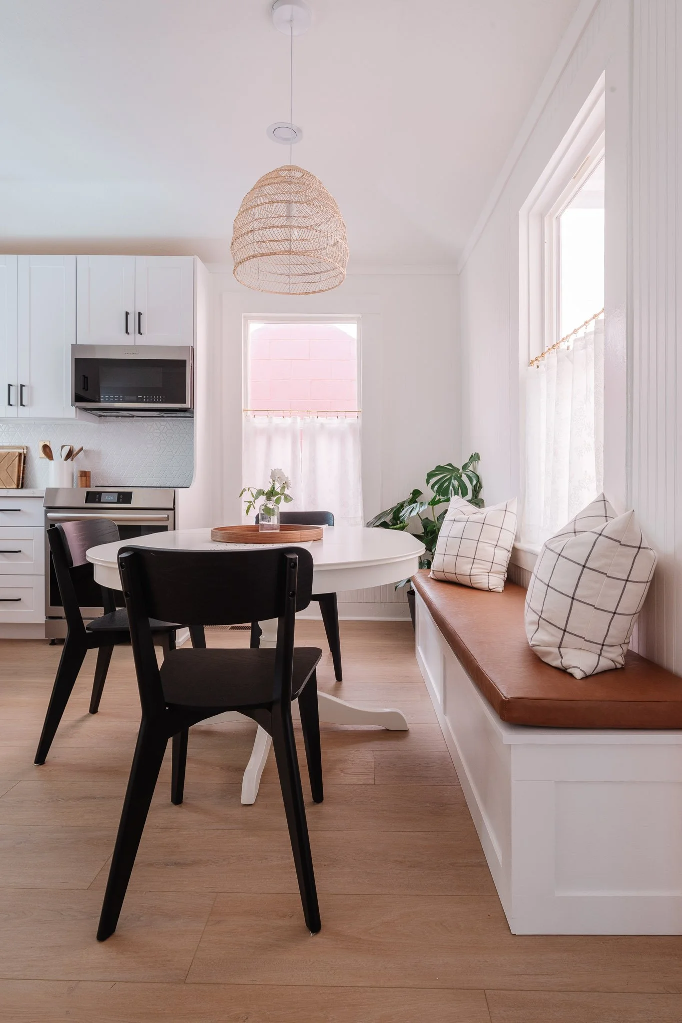 Dining room with a white table and seating for six