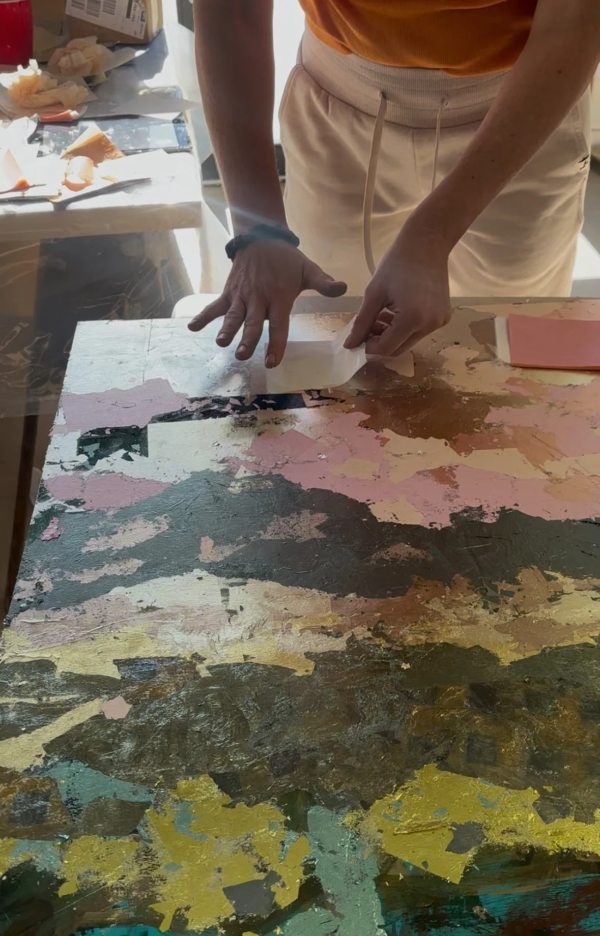 Artist working mixed media into a painting surface in the studio, Elizabeth Page