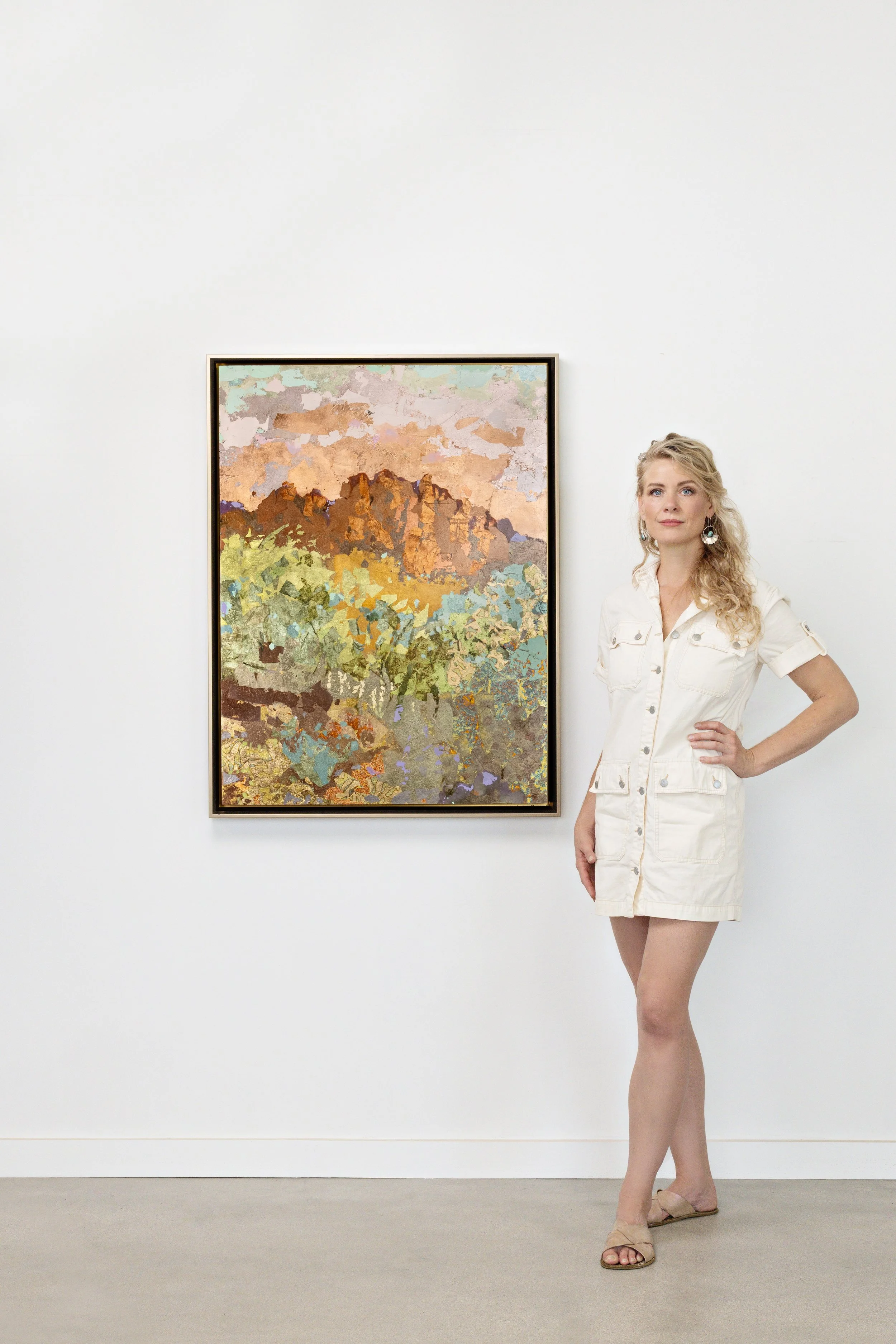 Elizabeth Page with mixed metal landscape painting. metal leaf, gold, silver. gallery