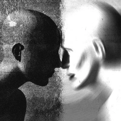 Silhouettes of two individuals facing each other closely.