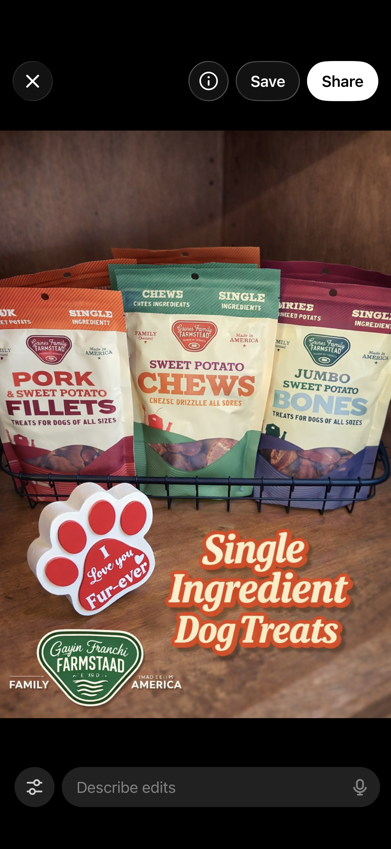 Three bags of dog treats in a wire basket, labeled as pork, sweet potato chews, and jumbo sweet potato bones, with a sign reading 'Single Ingredient Dog Treats' and a decorative paw print with the words 'Love you Fur-ever'.