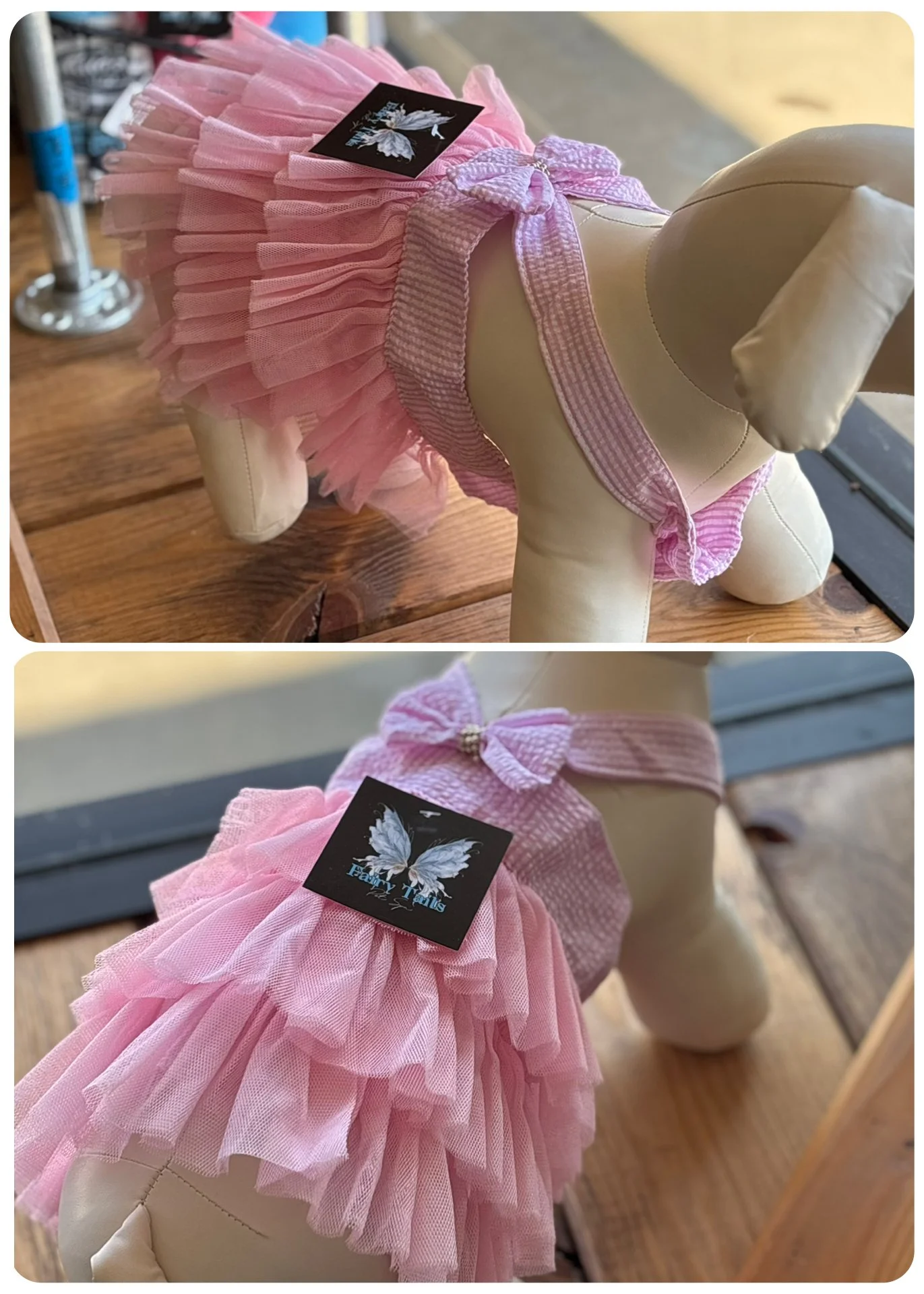 A dog mannequin dressed in a pink tutu and bow harness with a butterfly tag.